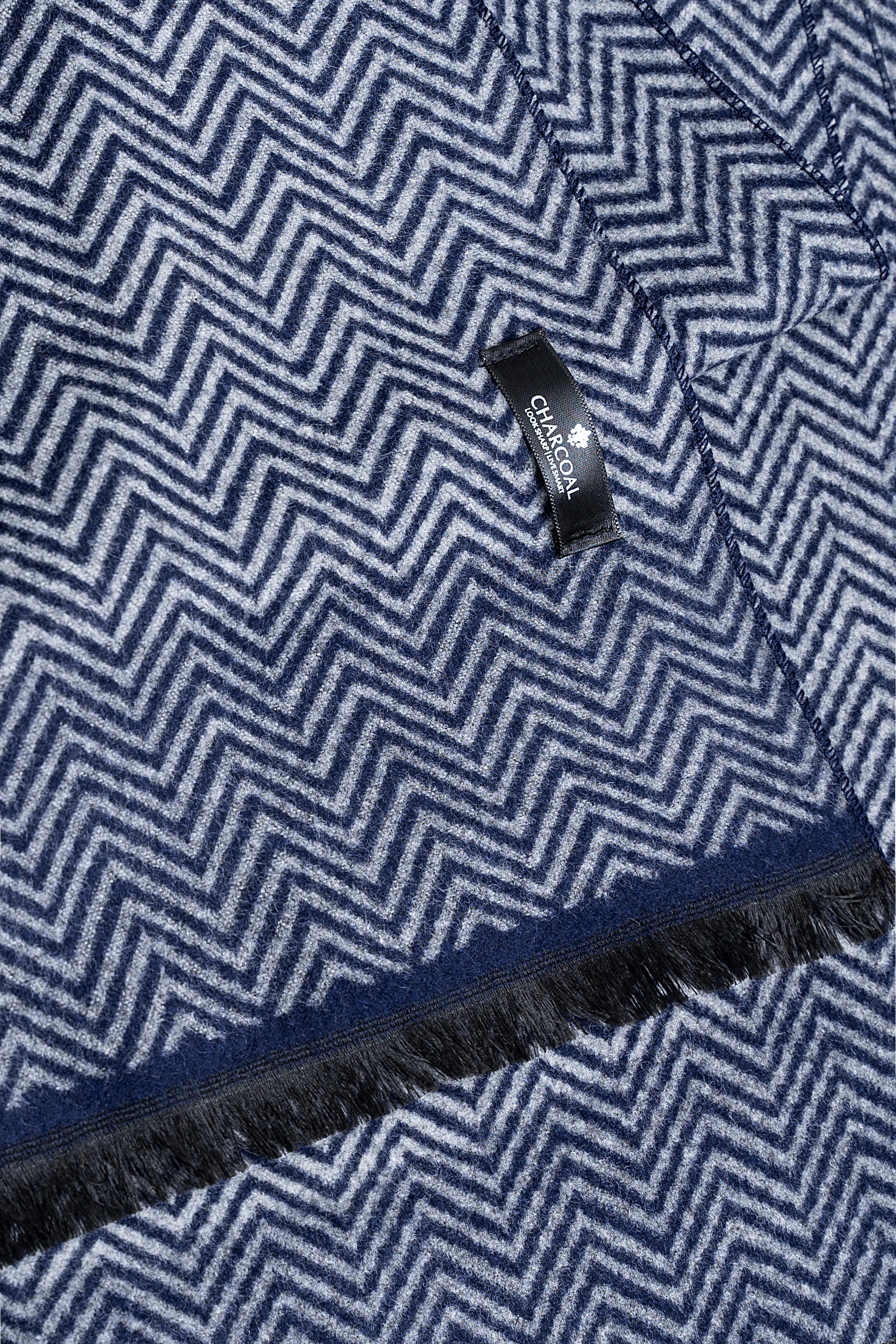 Navy chevron scarf detail with fringe and woven tag