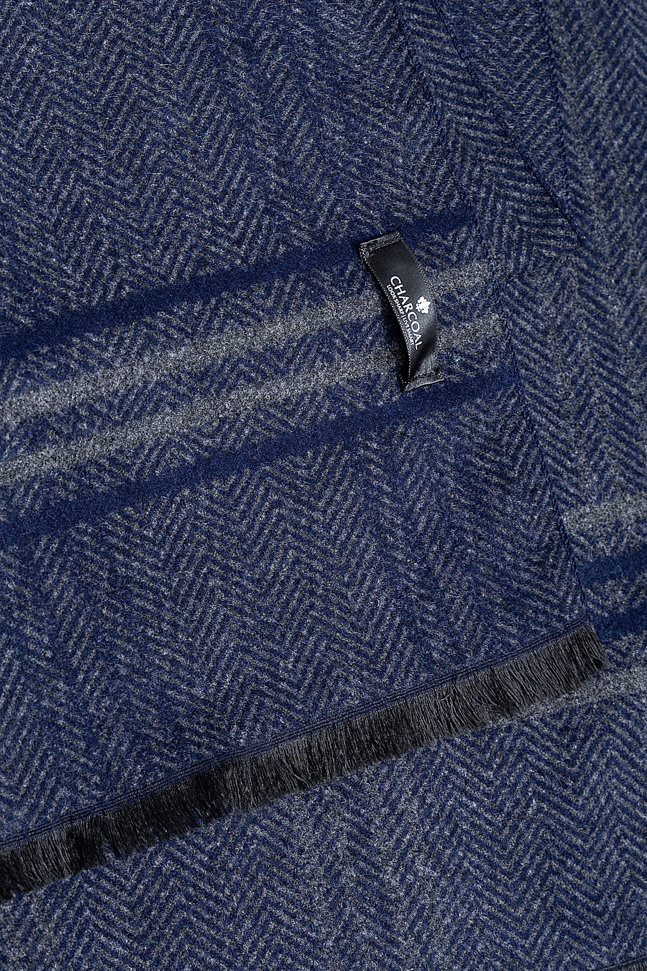 Navy herringbone scarf with small brand tag and dark end trim