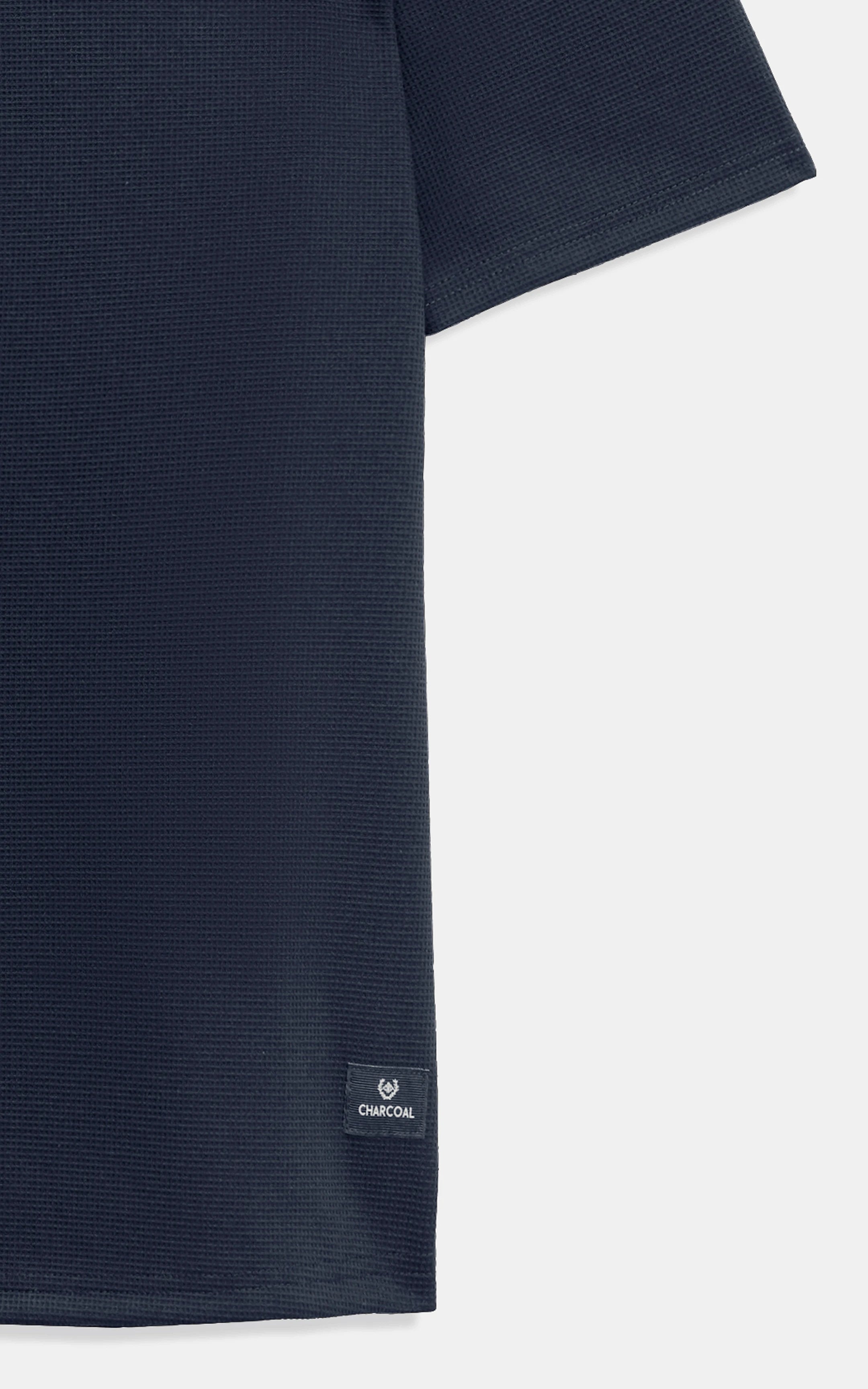 Navy T-shirt hem with stitched logo patch detail