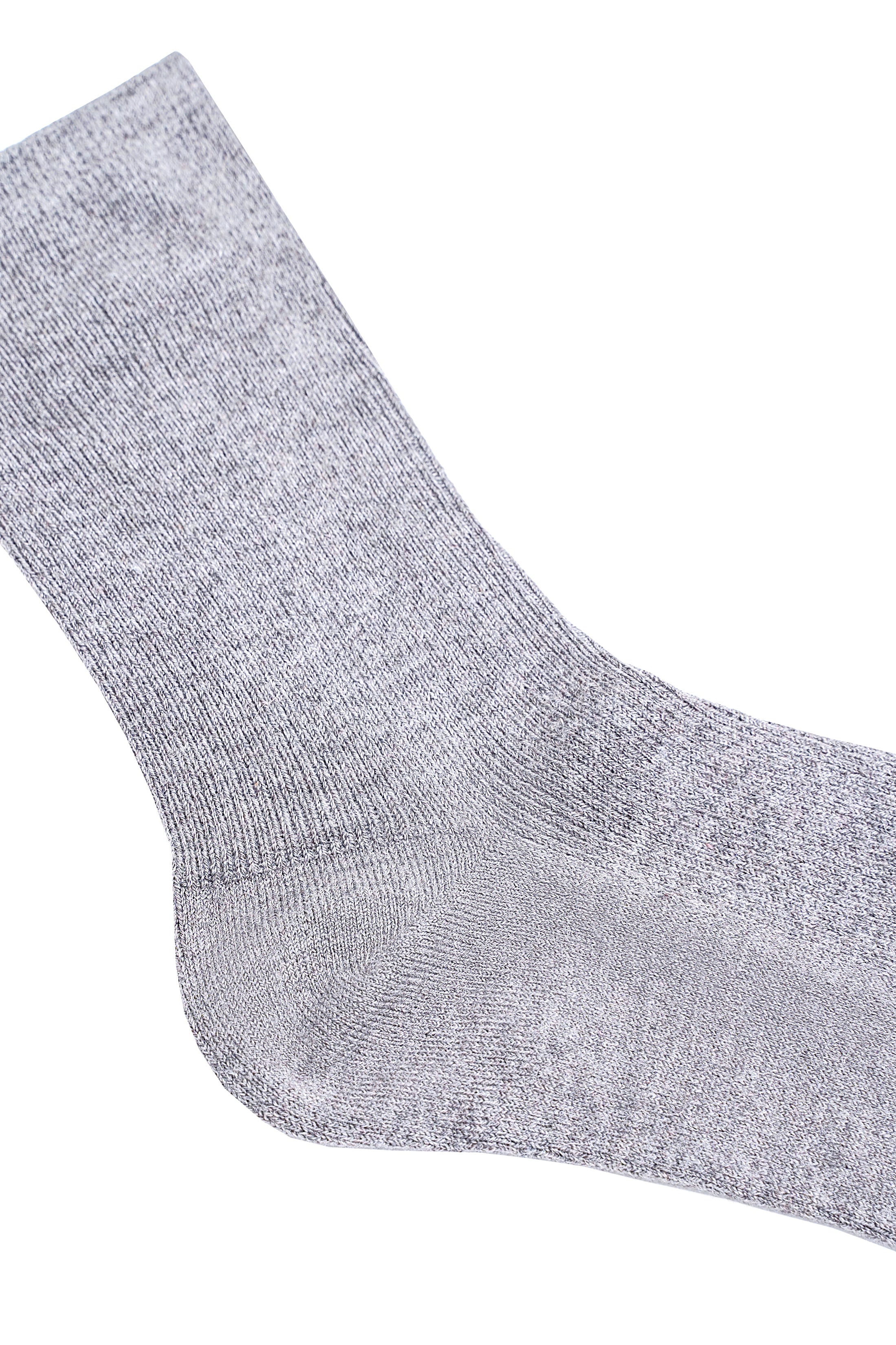 Gray wool sock knit texture close-up with toe seam detail