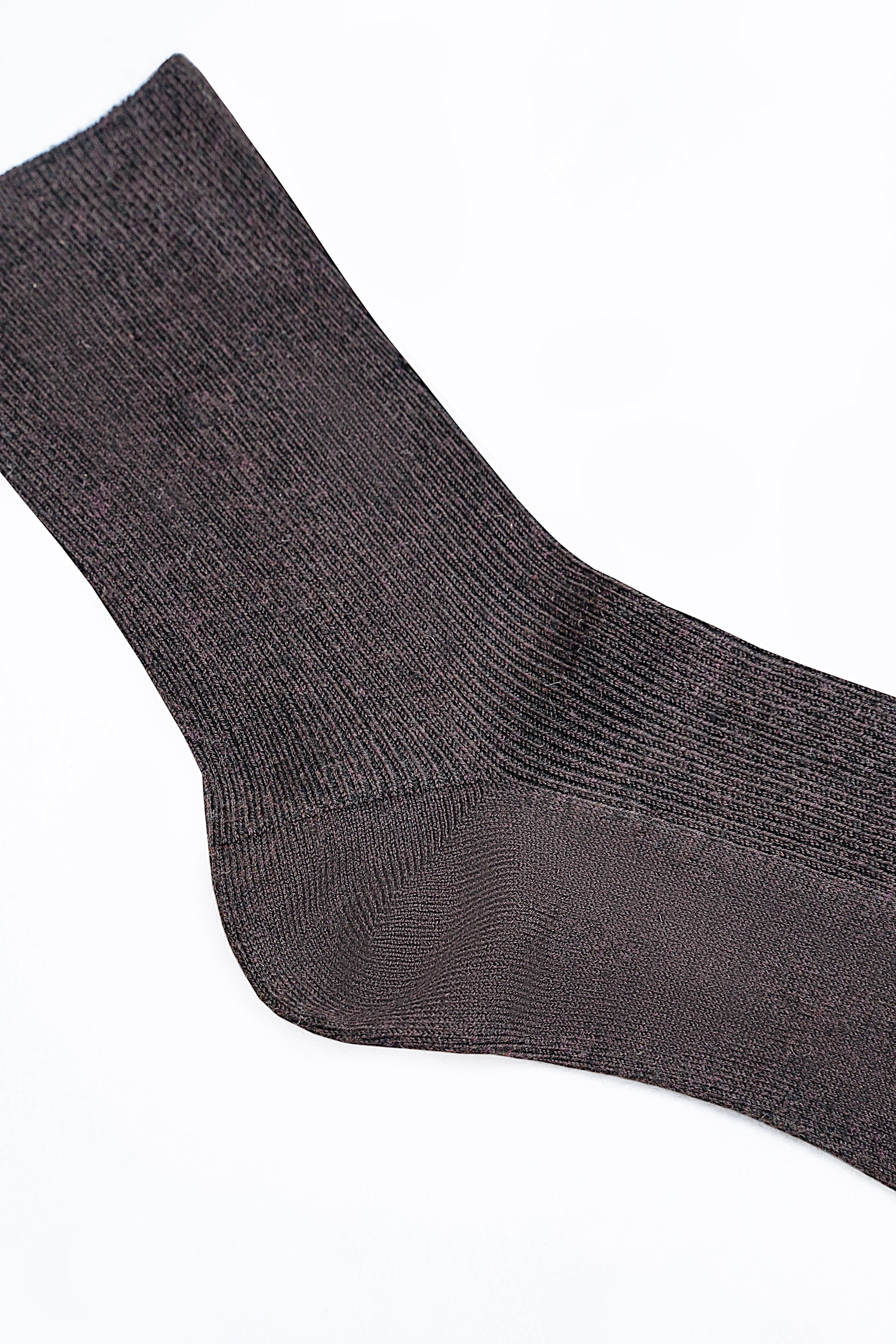 Dark gray wool sock showing stitched toe and ribbed knit texture