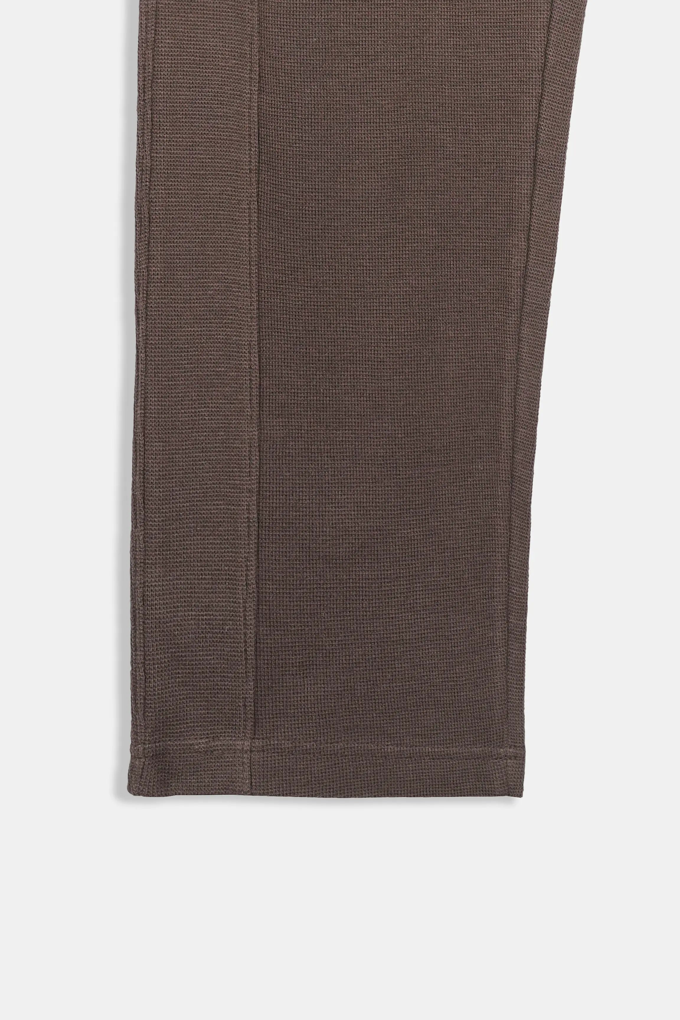 Brown knit trouser hem with straight leg seam