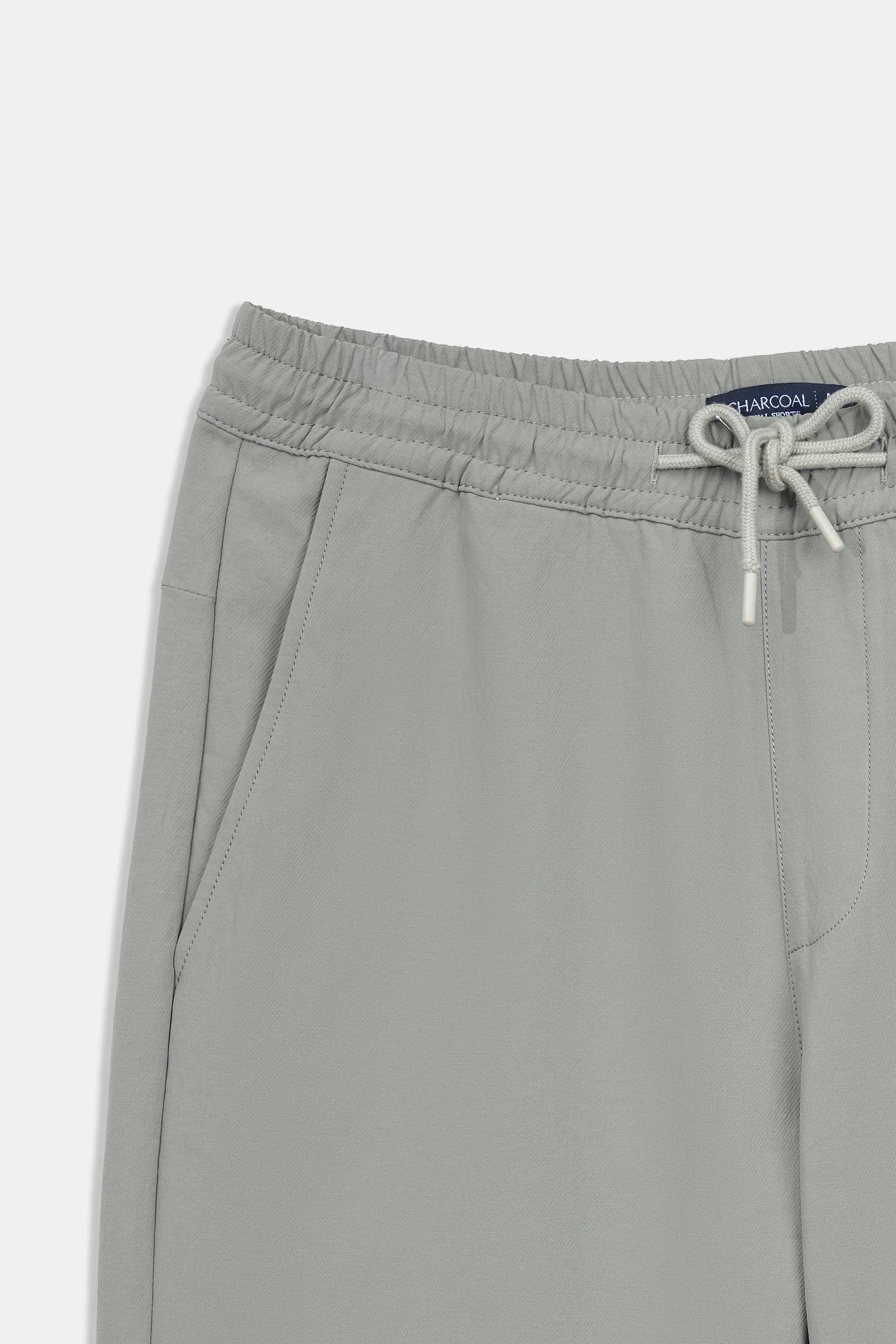 Olive shorts with elastic waistband and white drawstring ties.