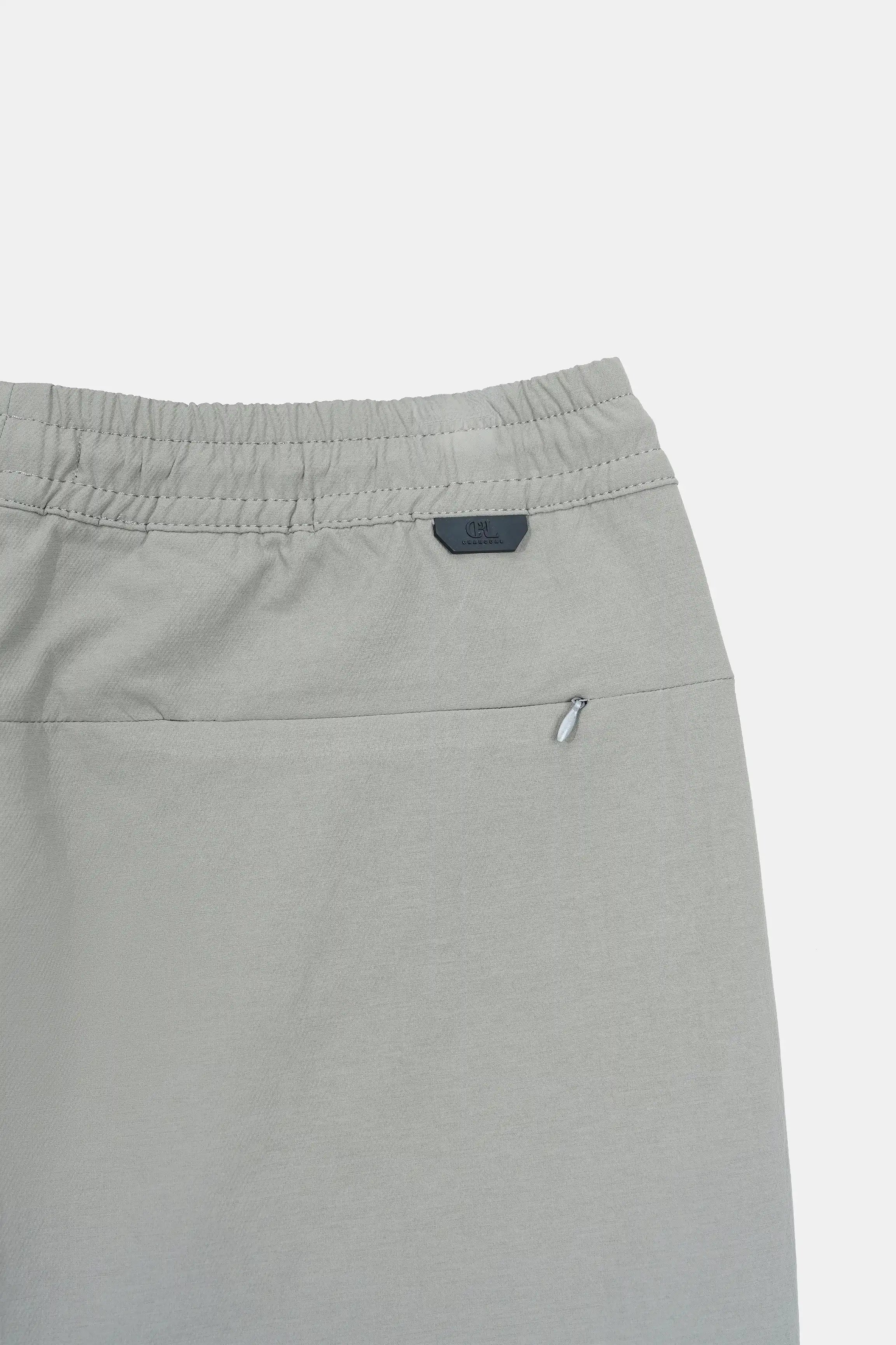 Olive shorts with small front logo label under the waistband.