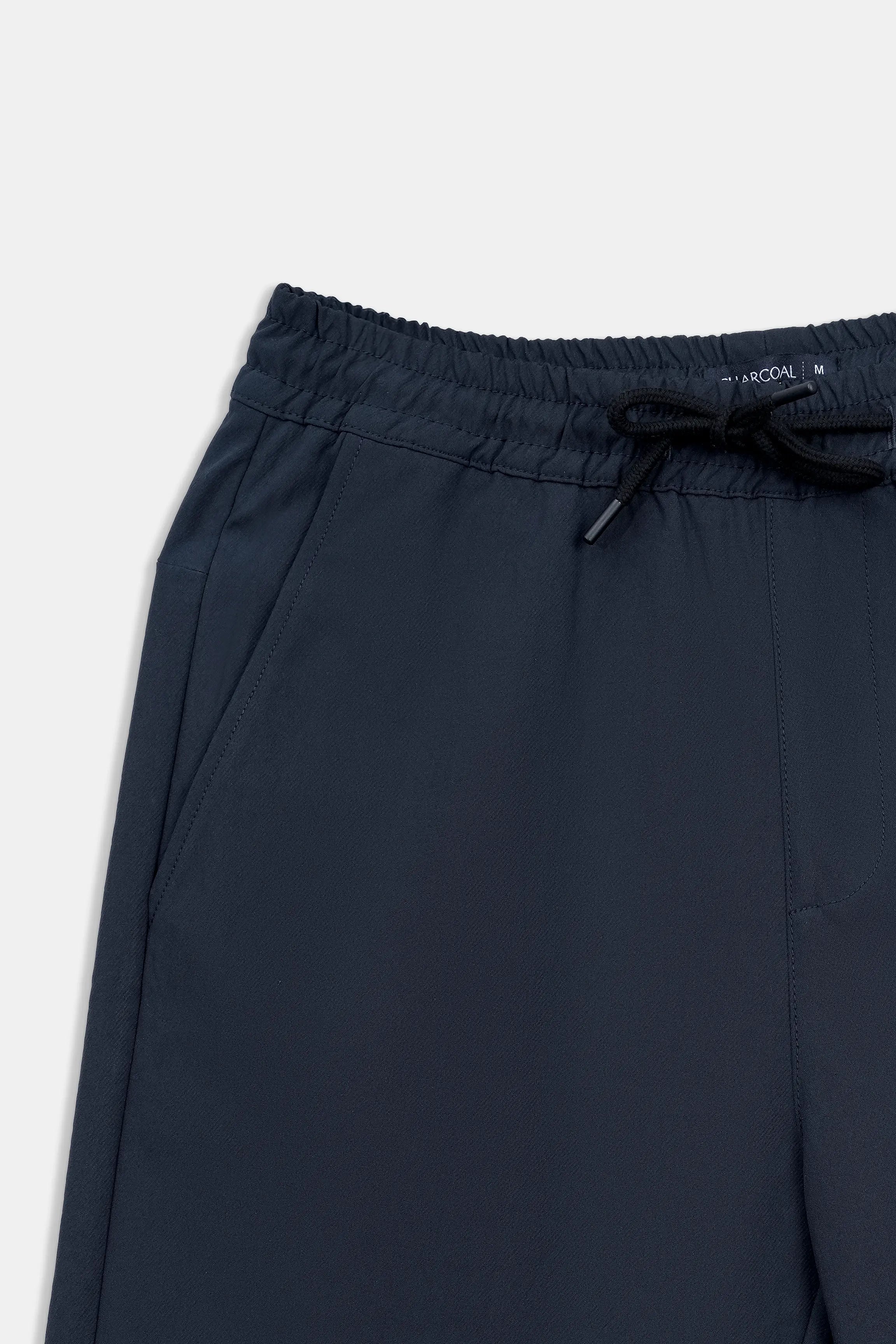 Navy regular-fit shorts, waistband close-up with elastic band and drawstring