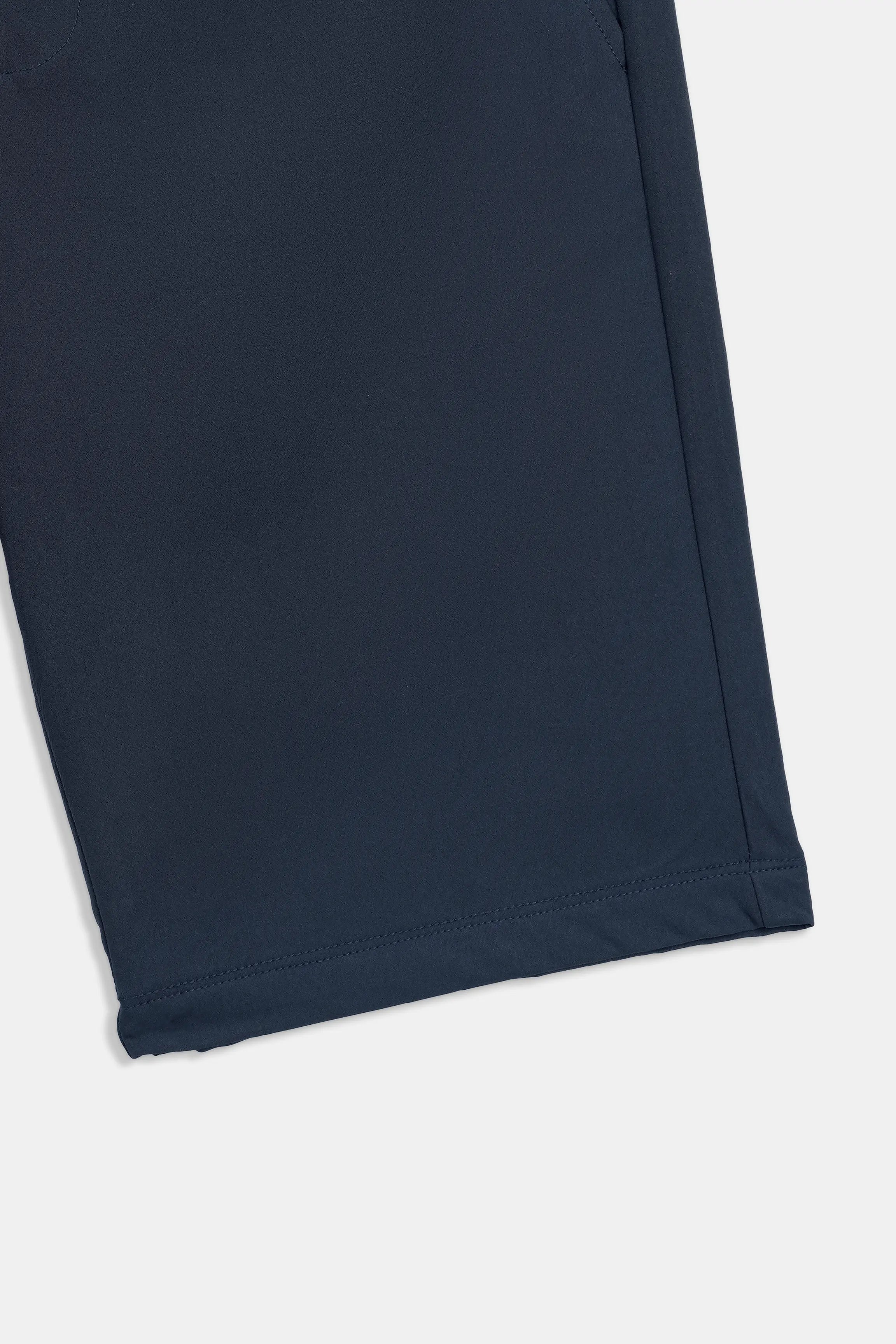 Navy regular-fit shorts, fabric close-up of hem and side seam