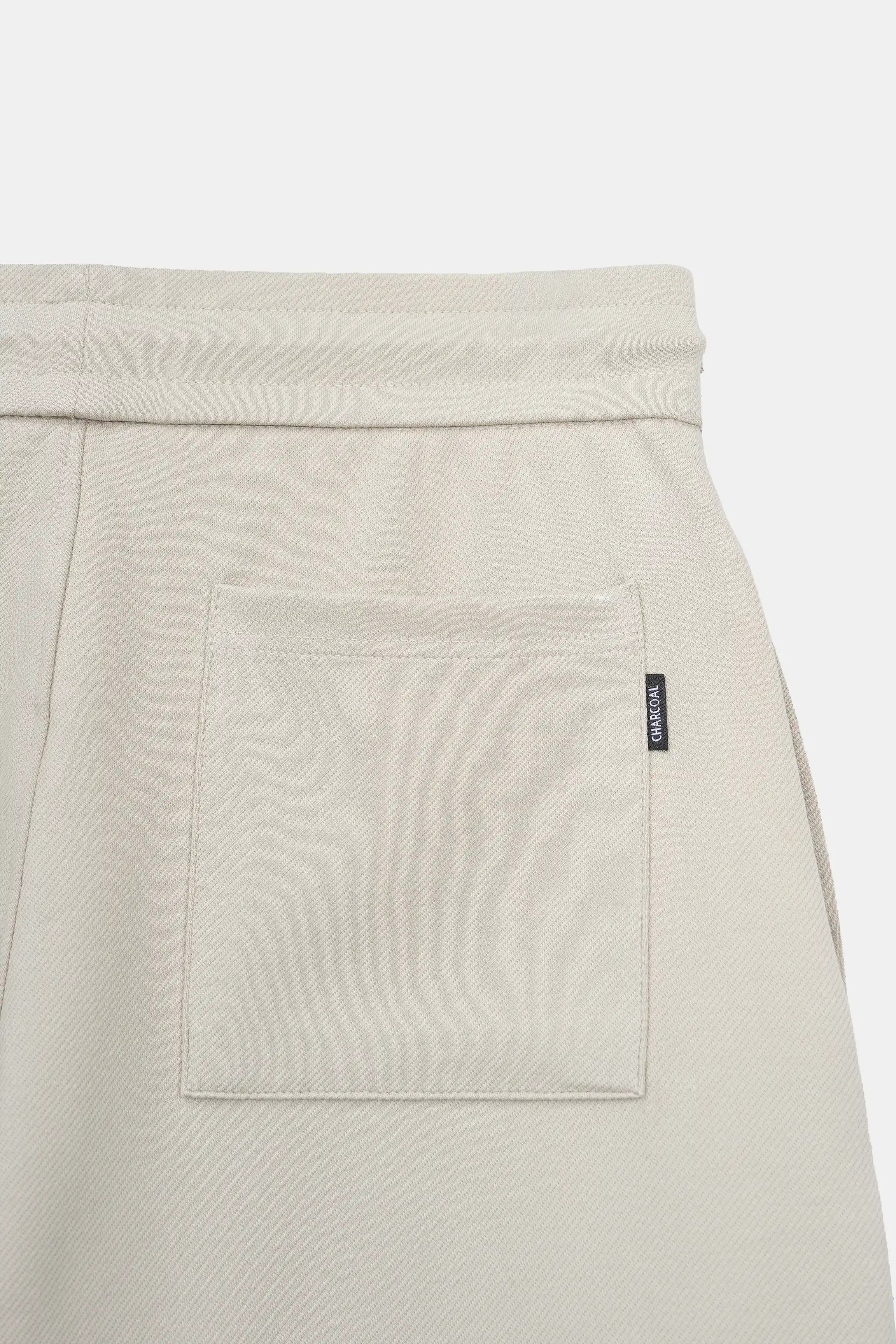 Stone shorts with front pocket panel and small branded label