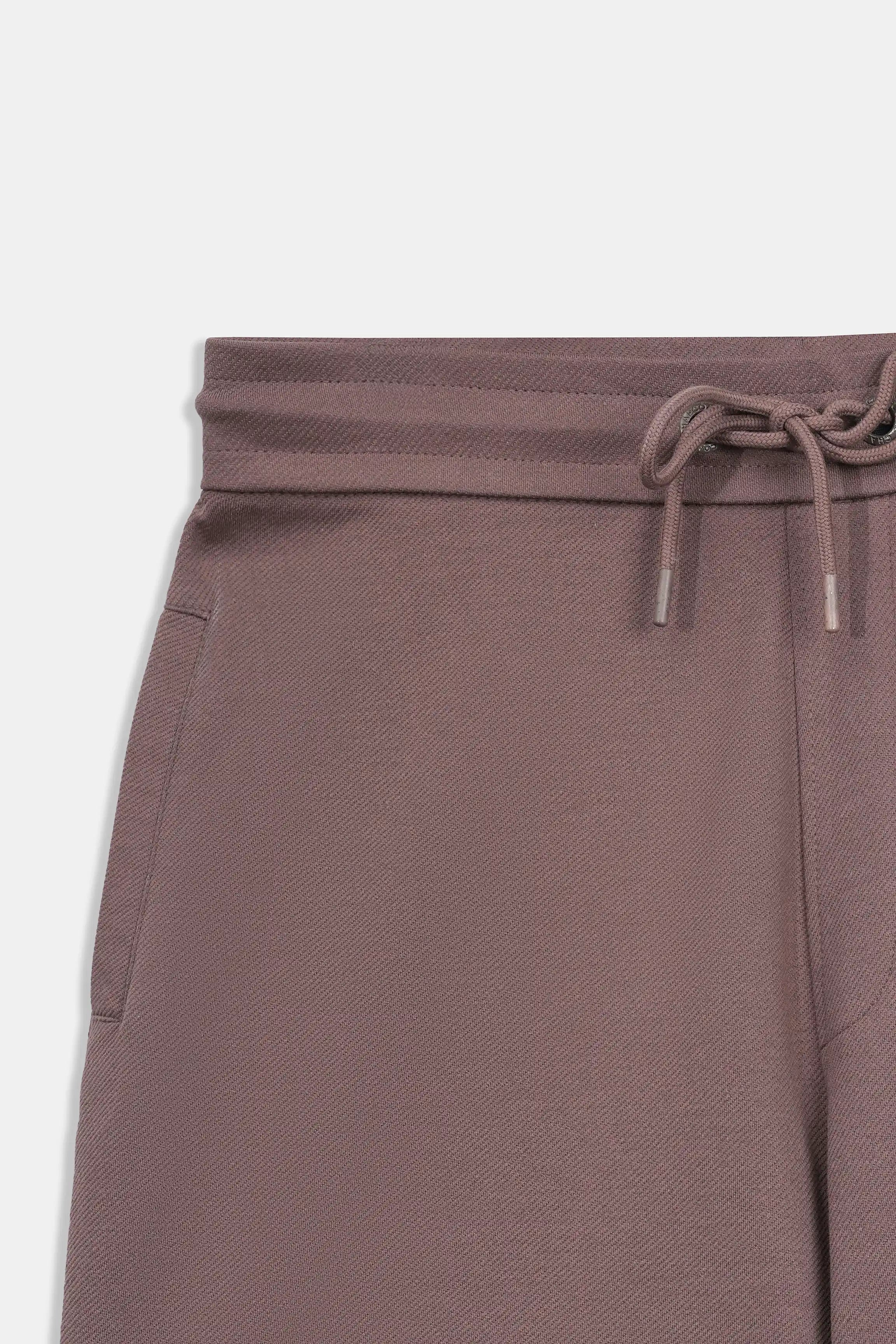 Rust-brown drawstring waistband detail on men's regular-fit shorts.