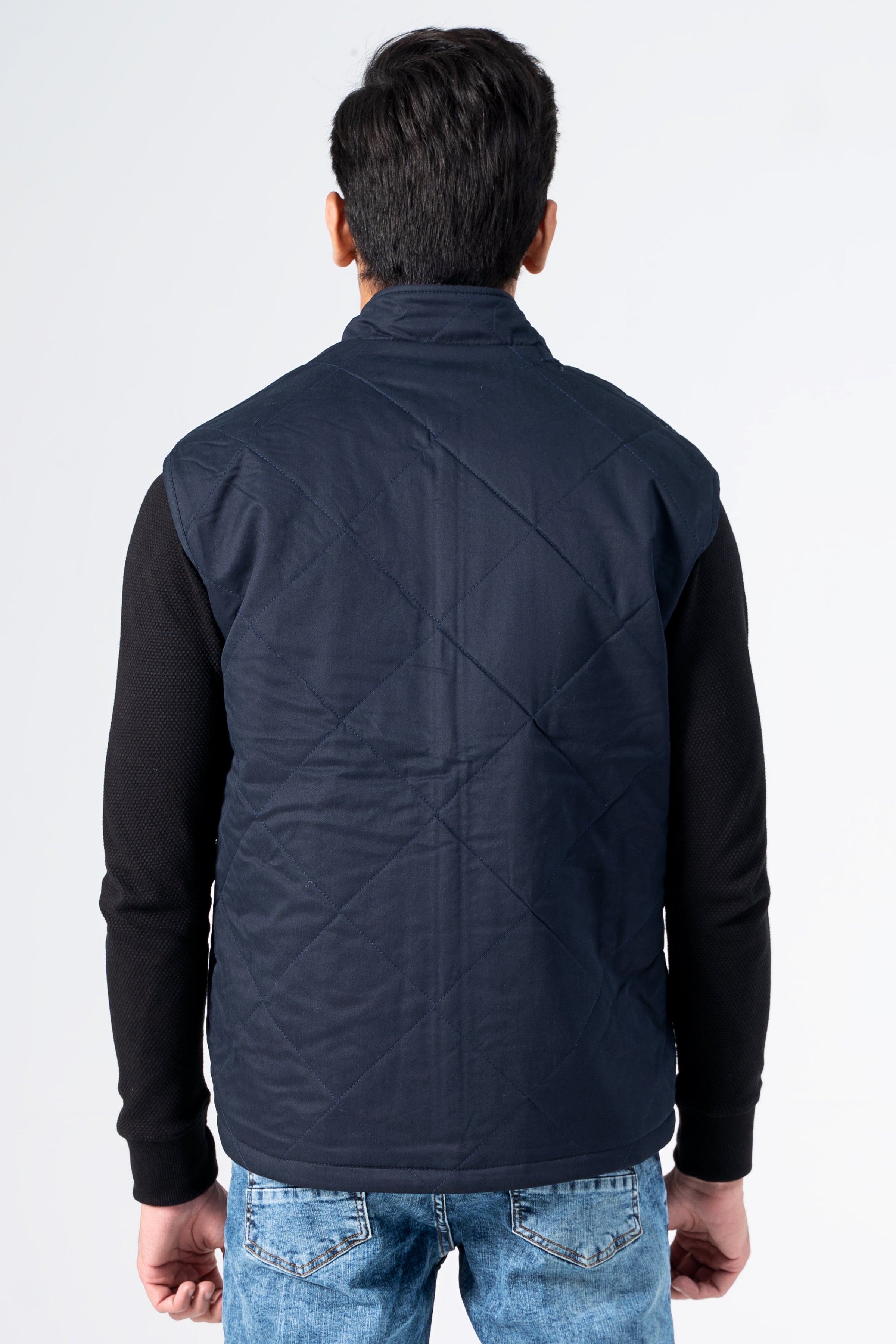 Reversible quilted jacket, dark navy back panel with diagonal quilting and zip closure