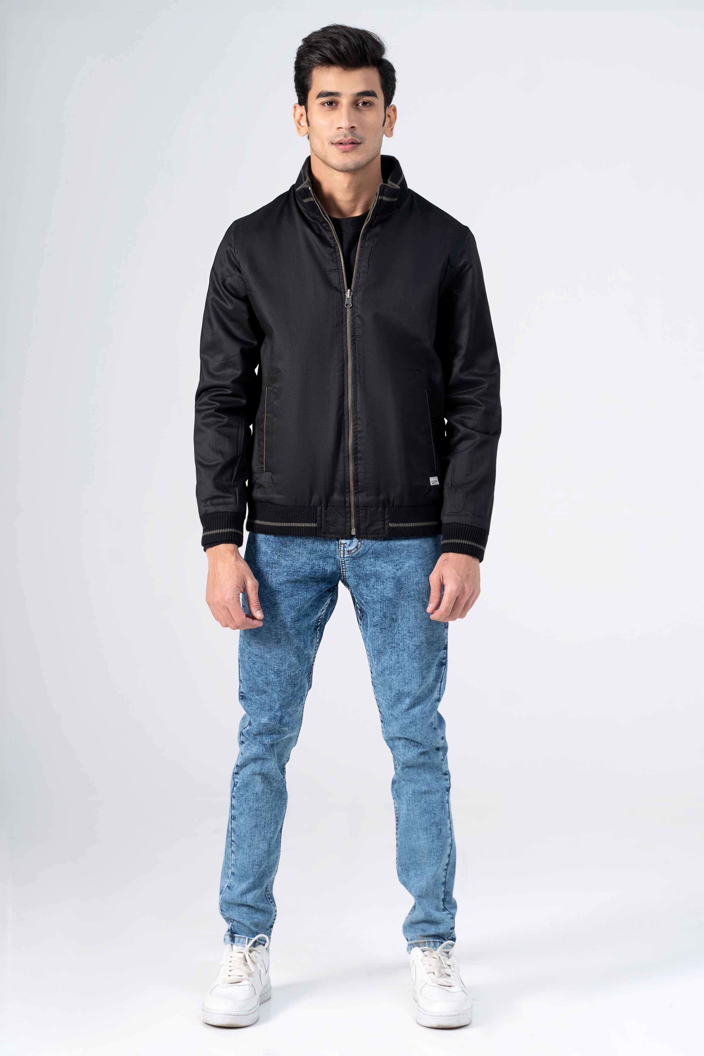 Reversible jacket in black with zip front, stand collar, ribbed cuffs and hem