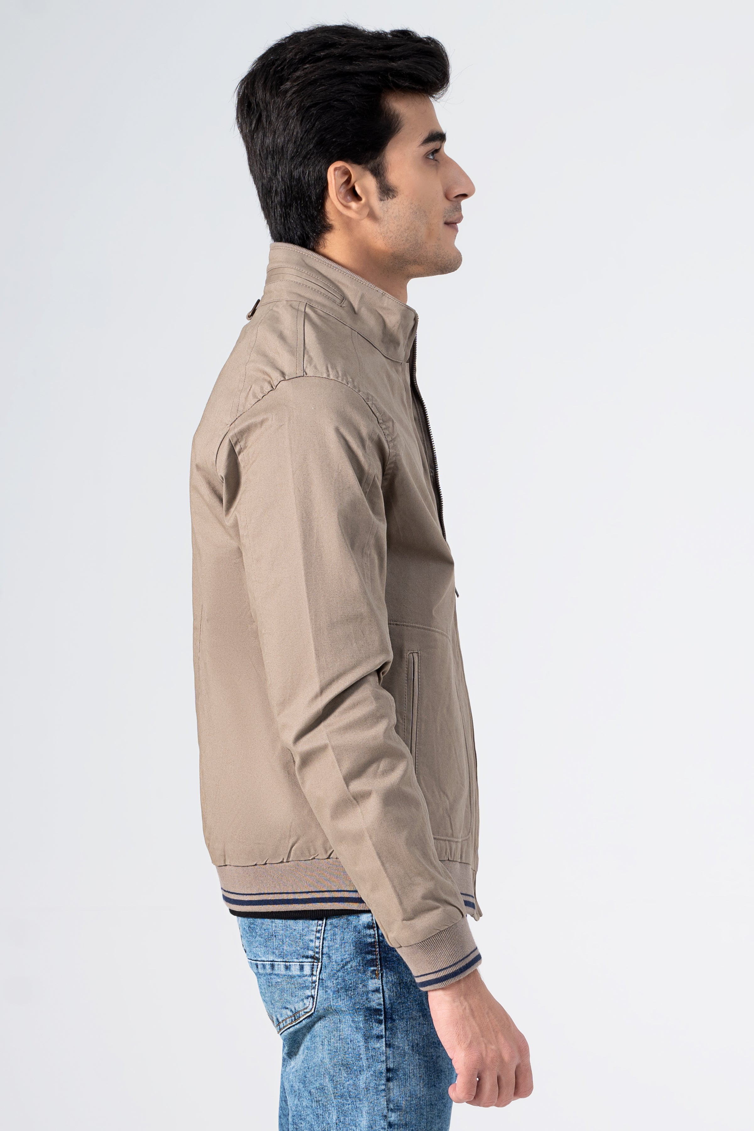 Khaki cotton jacket in profile view with stand collar and zip front