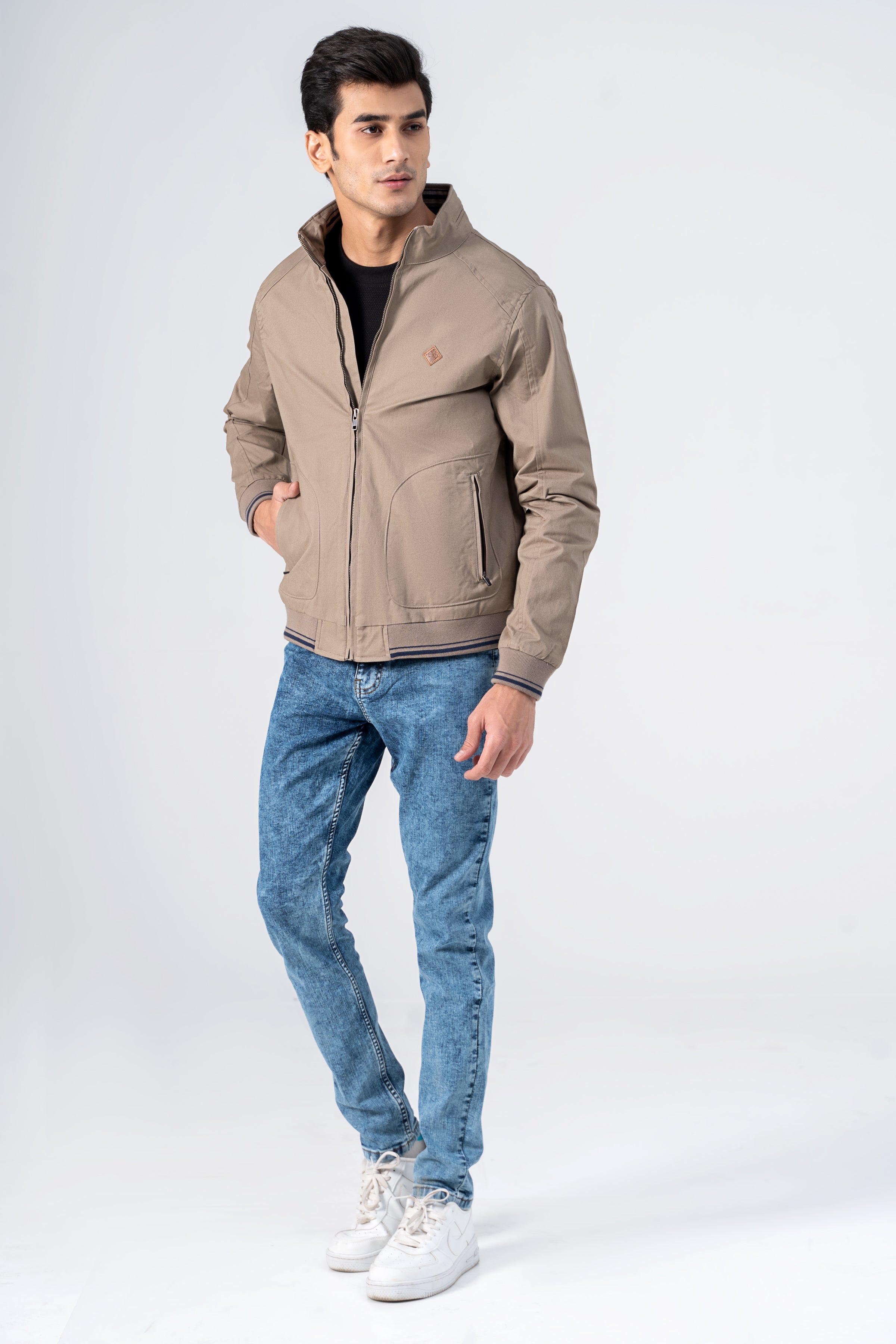 Khaki cotton jacket with stand collar, zip front, side pockets, ribbed cuffs