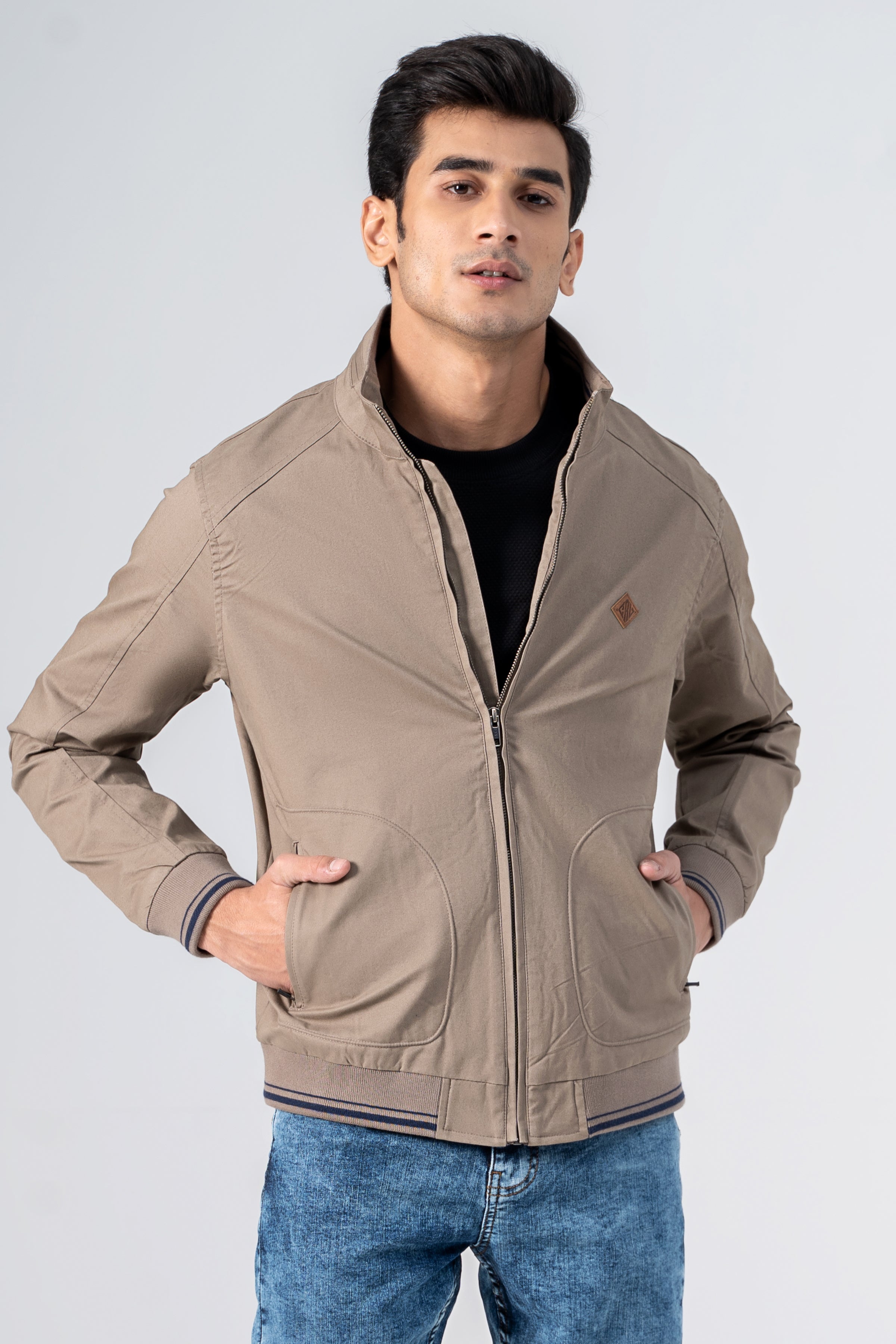 Khaki cotton jacket with stand collar, zip front, and ribbed trim at cuffs
