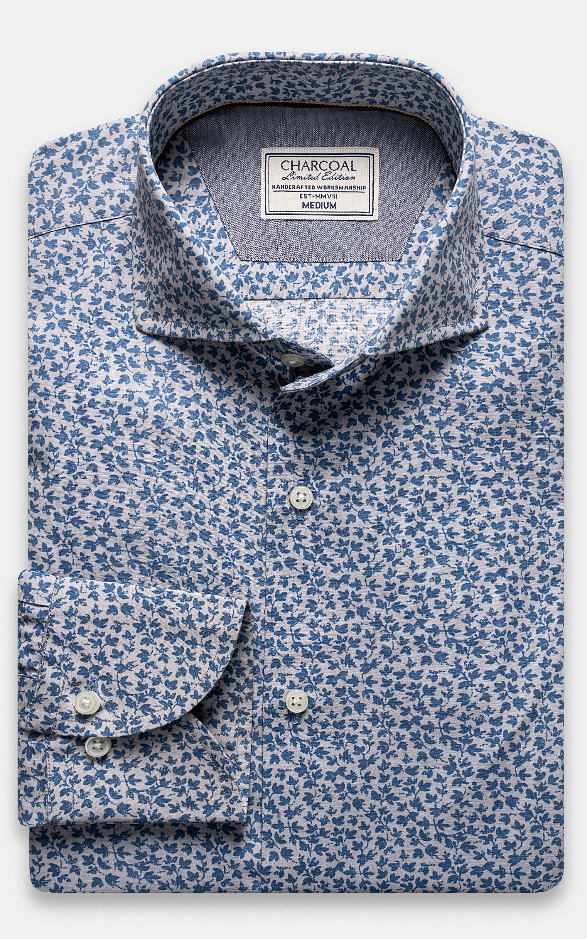 Floral button-up shirt with point collar and dark buttons, light blue patterned fabric