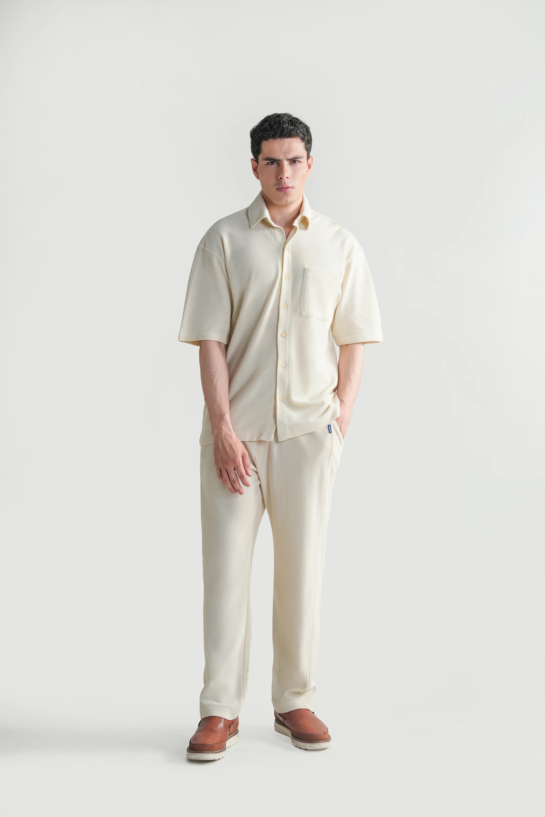 Off-white knit casual shirt with short sleeves and button-front placket