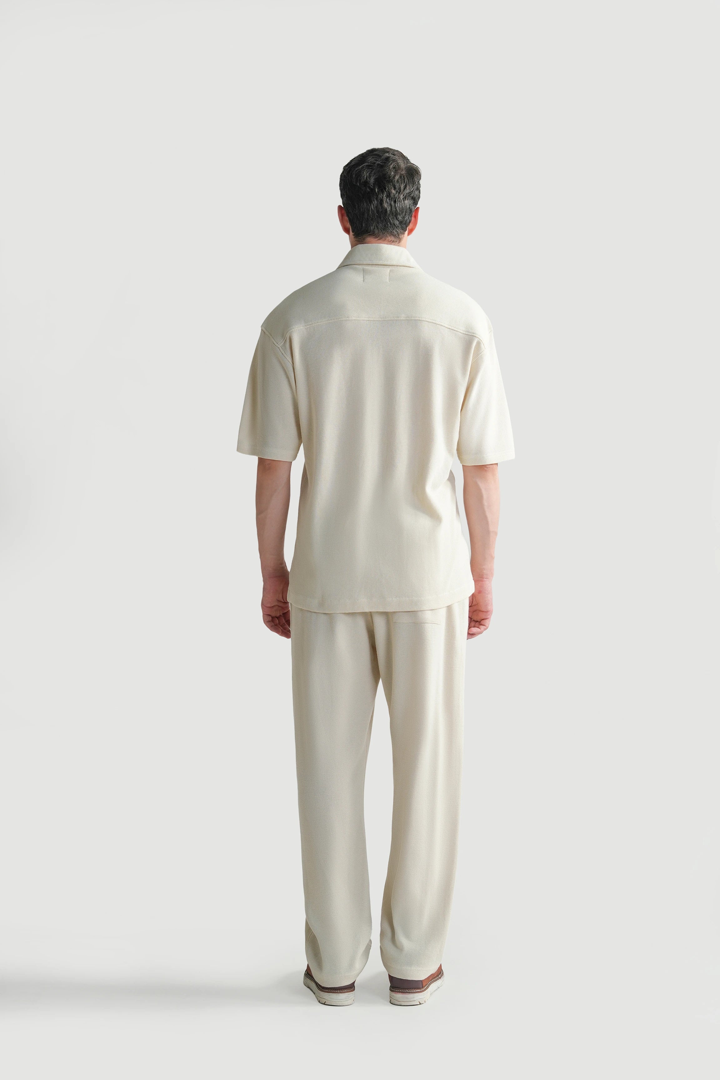 Off-white knit casual shirt, back view with short sleeves and straight hem