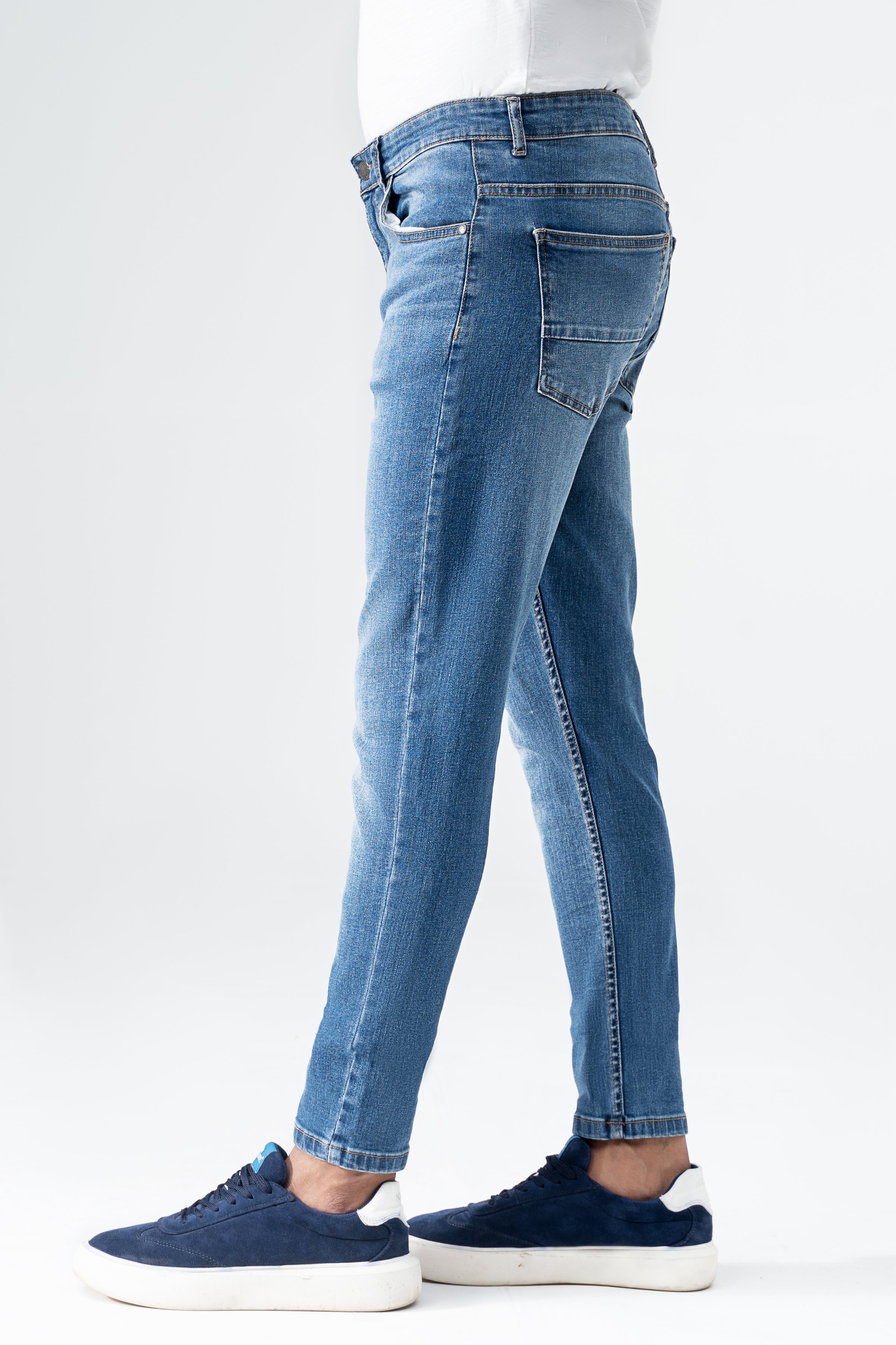 Mid-blue skinny-fit denim jeans with front pockets, belt loops, and straight skinny leg
