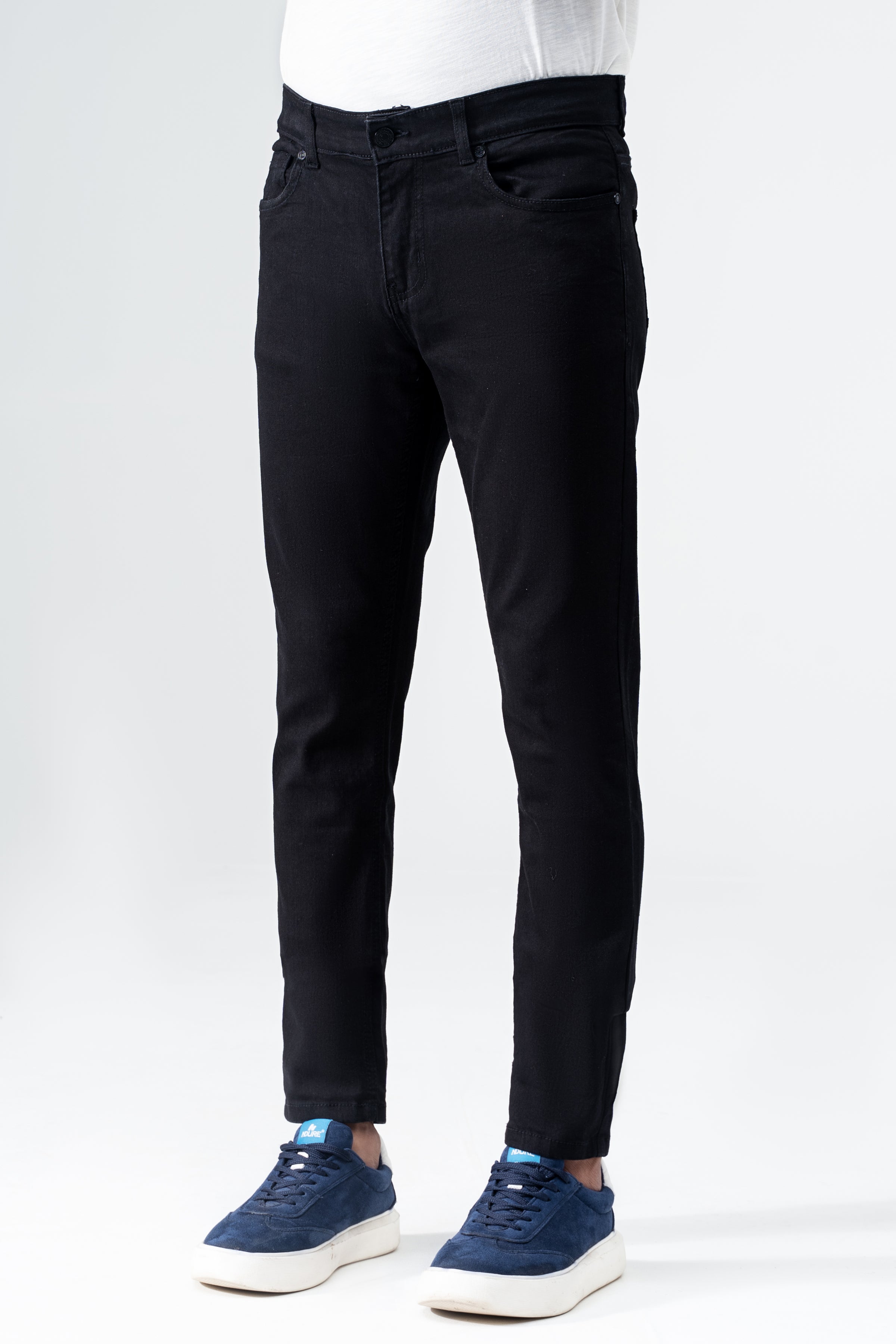 Black slim-leg denim jeans front view with button fly and tapered hem