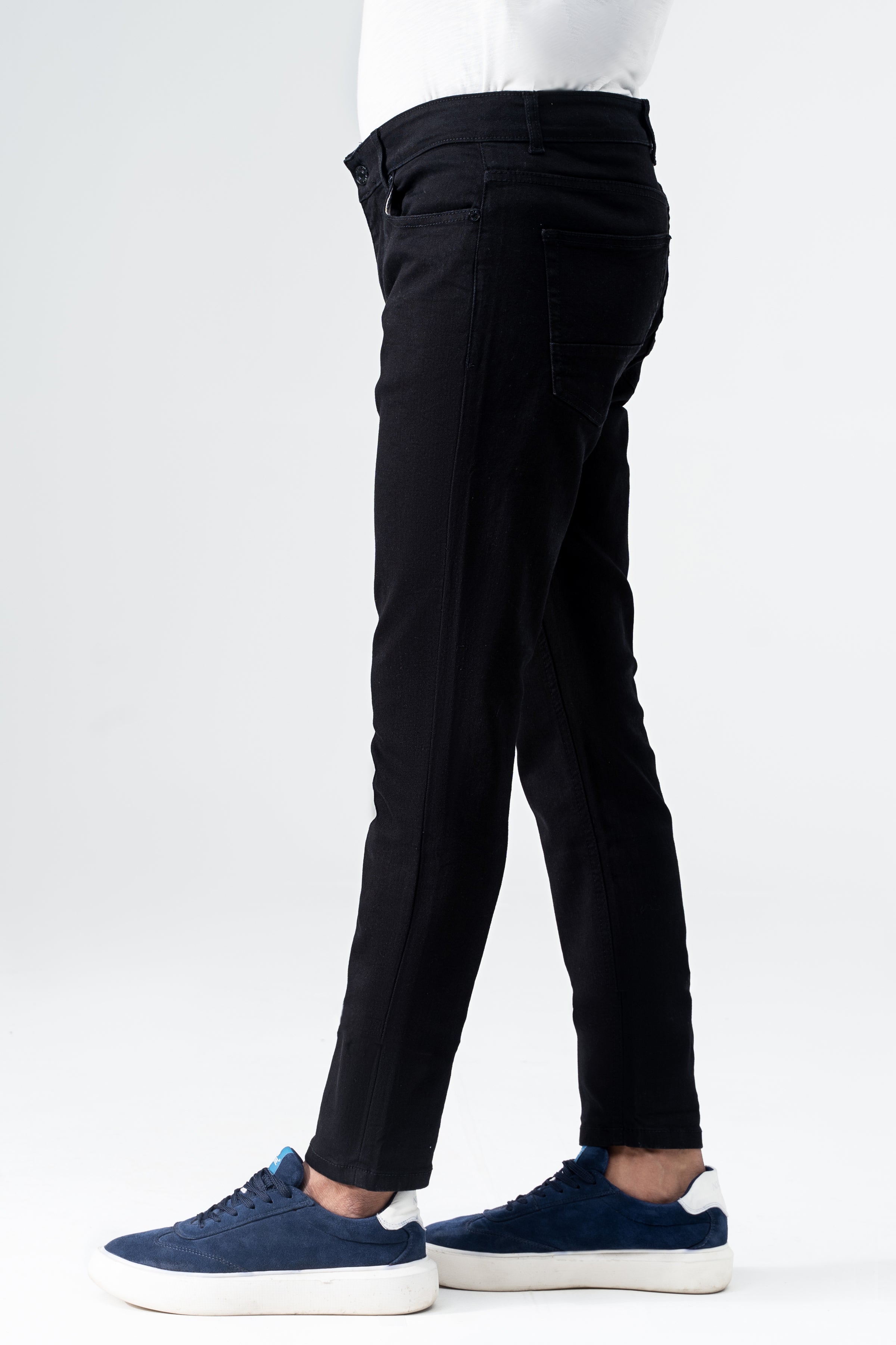 Black slim-leg denim jeans with button fly, belt loops, and tapered legs
