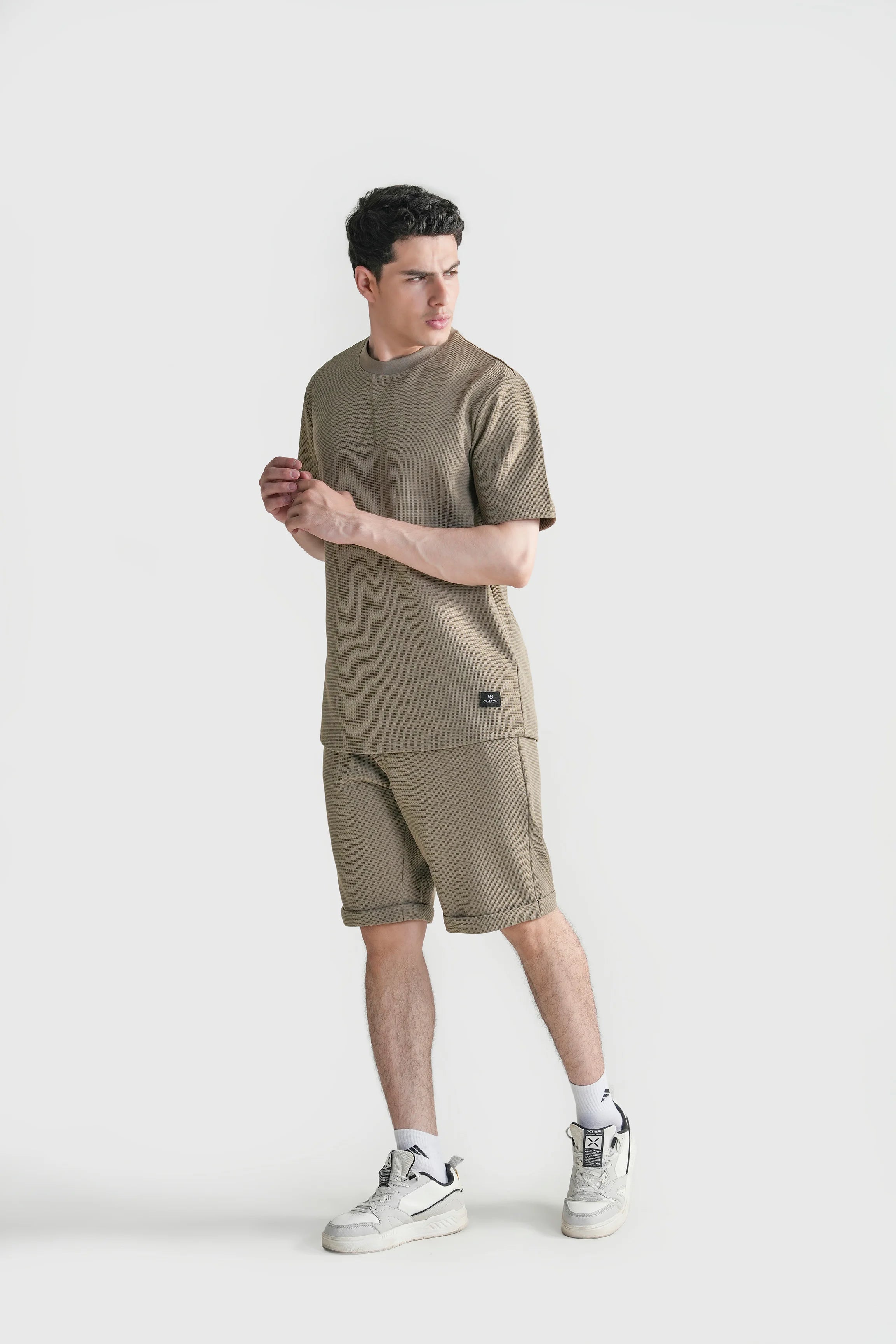 Oversized crew neck T-shirt in muted green, front view with small chest logo