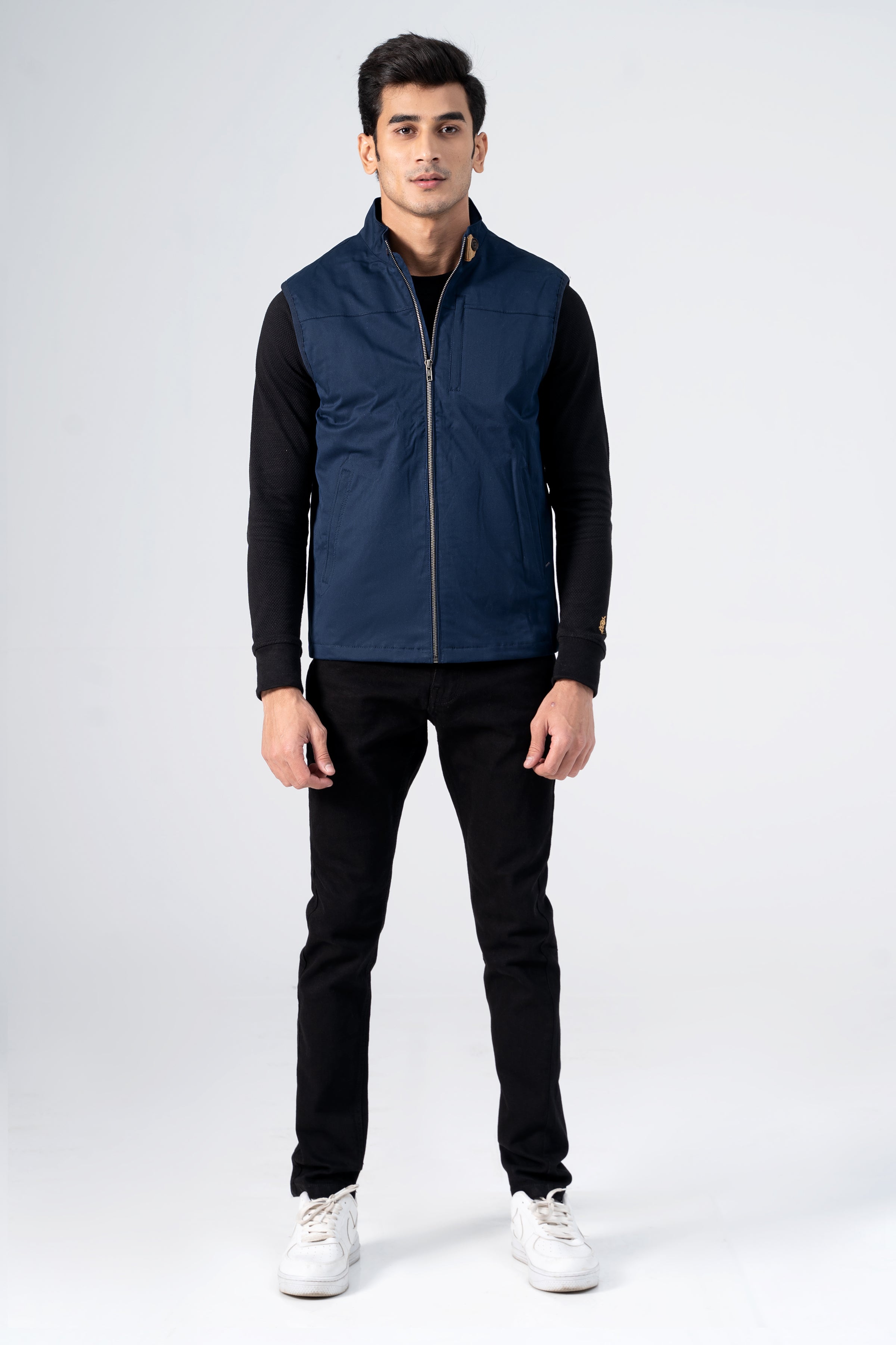 Navy wadded cotton jacket with full-zip front and stand collar