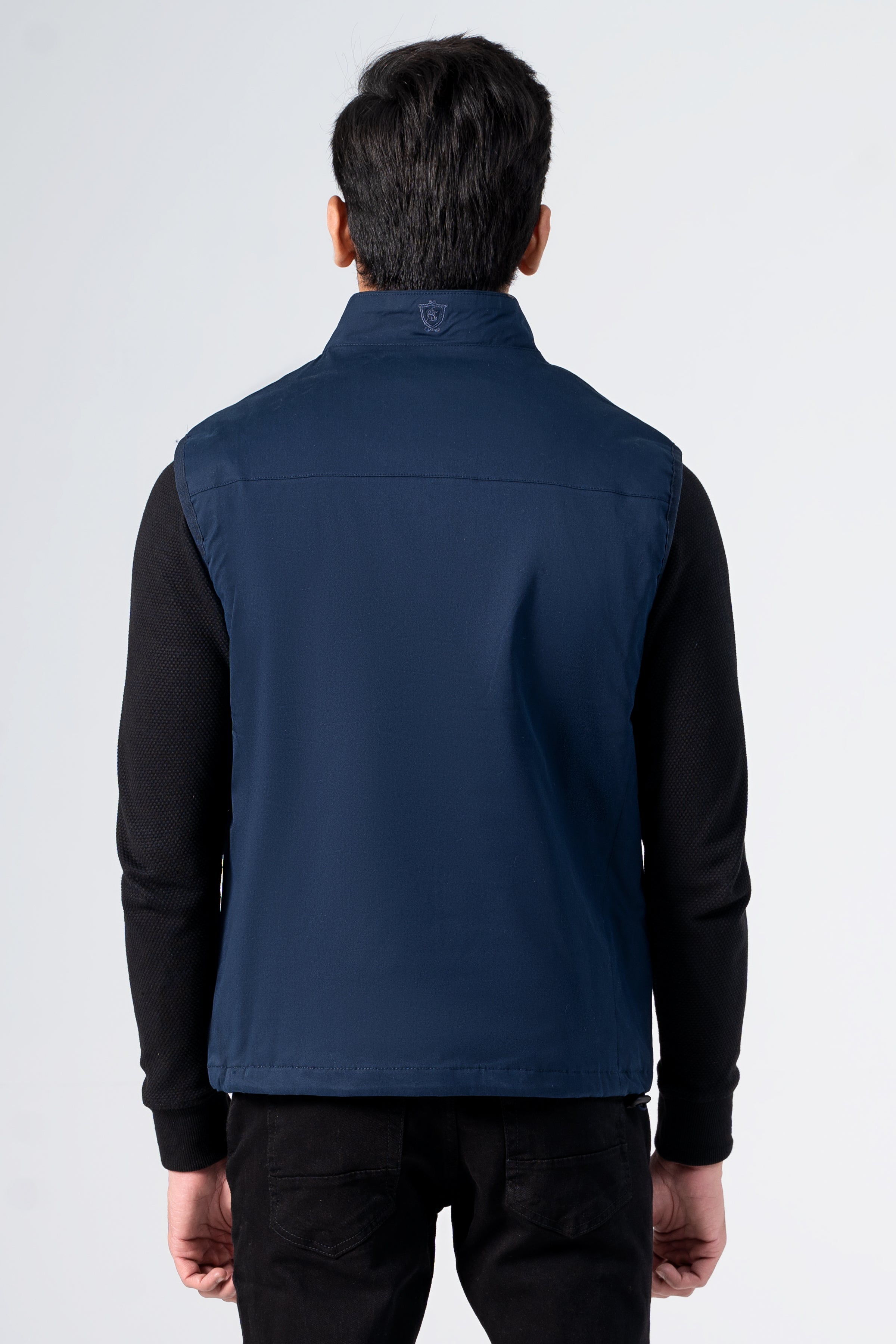 Navy wadded cotton jacket with high collar, back view
