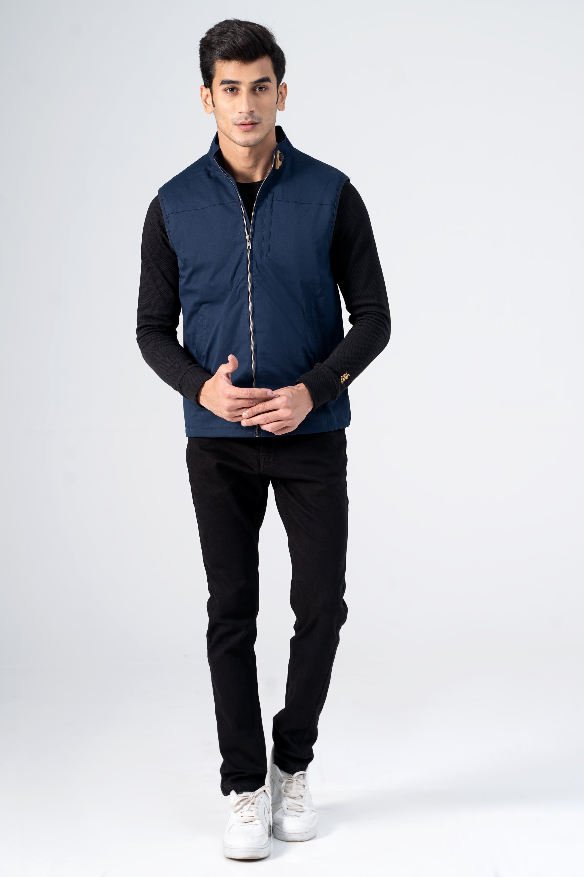 Navy wadded cotton jacket with full-zip front and stand collar, front view