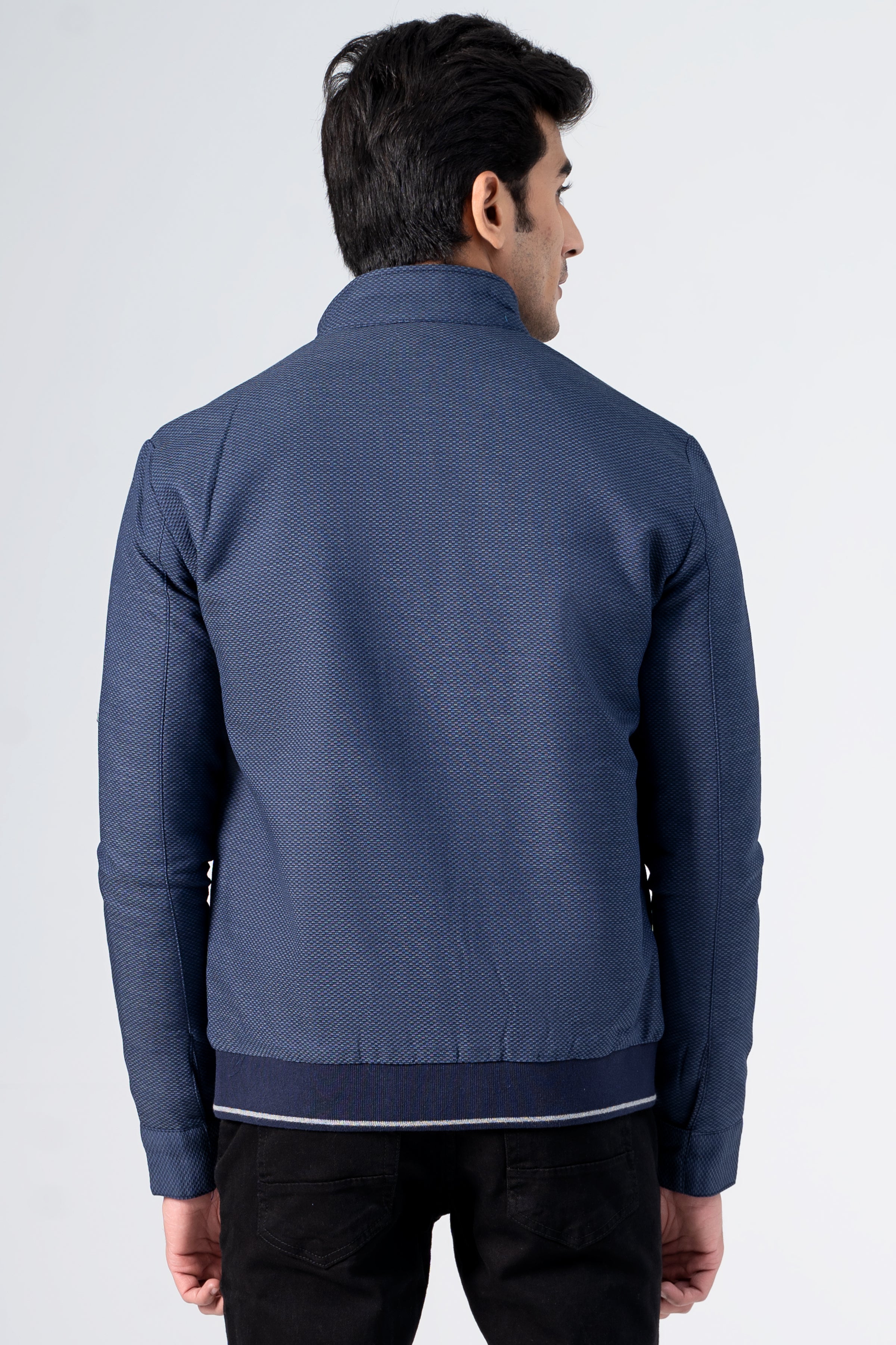 Navy textured zip-up jacket with stand collar and contrast hem, back view