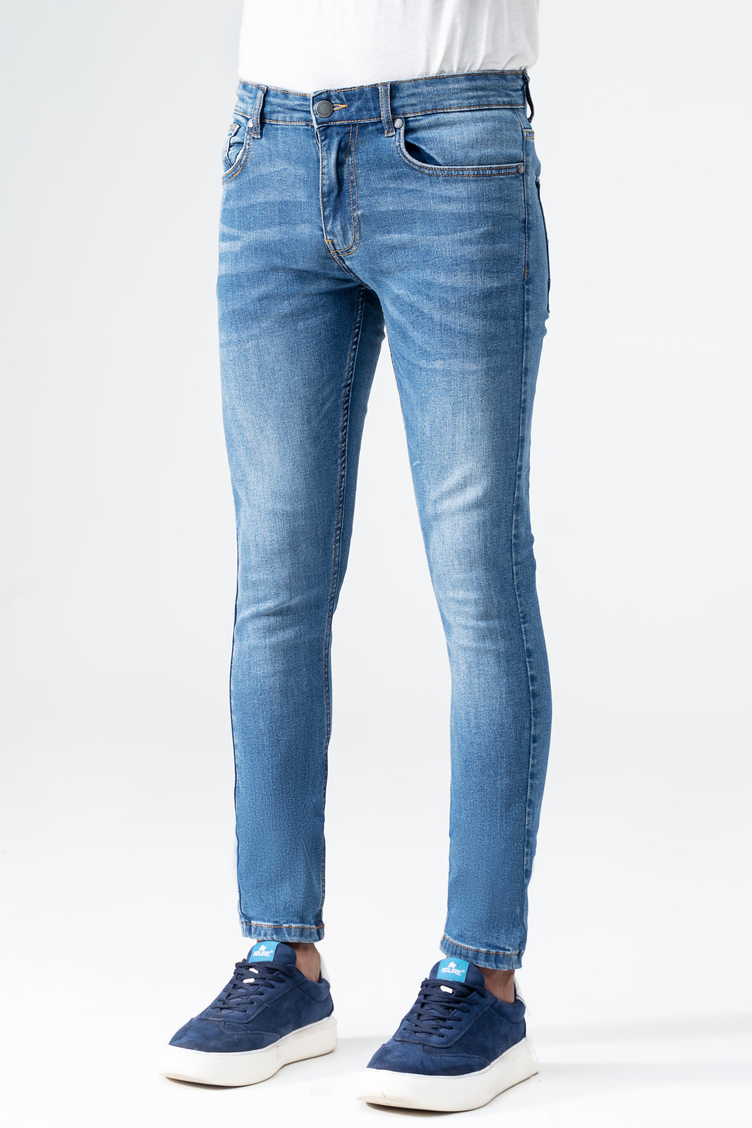 Men's slim-fit mid-blue denim jeans, front view with tapered leg and front pockets