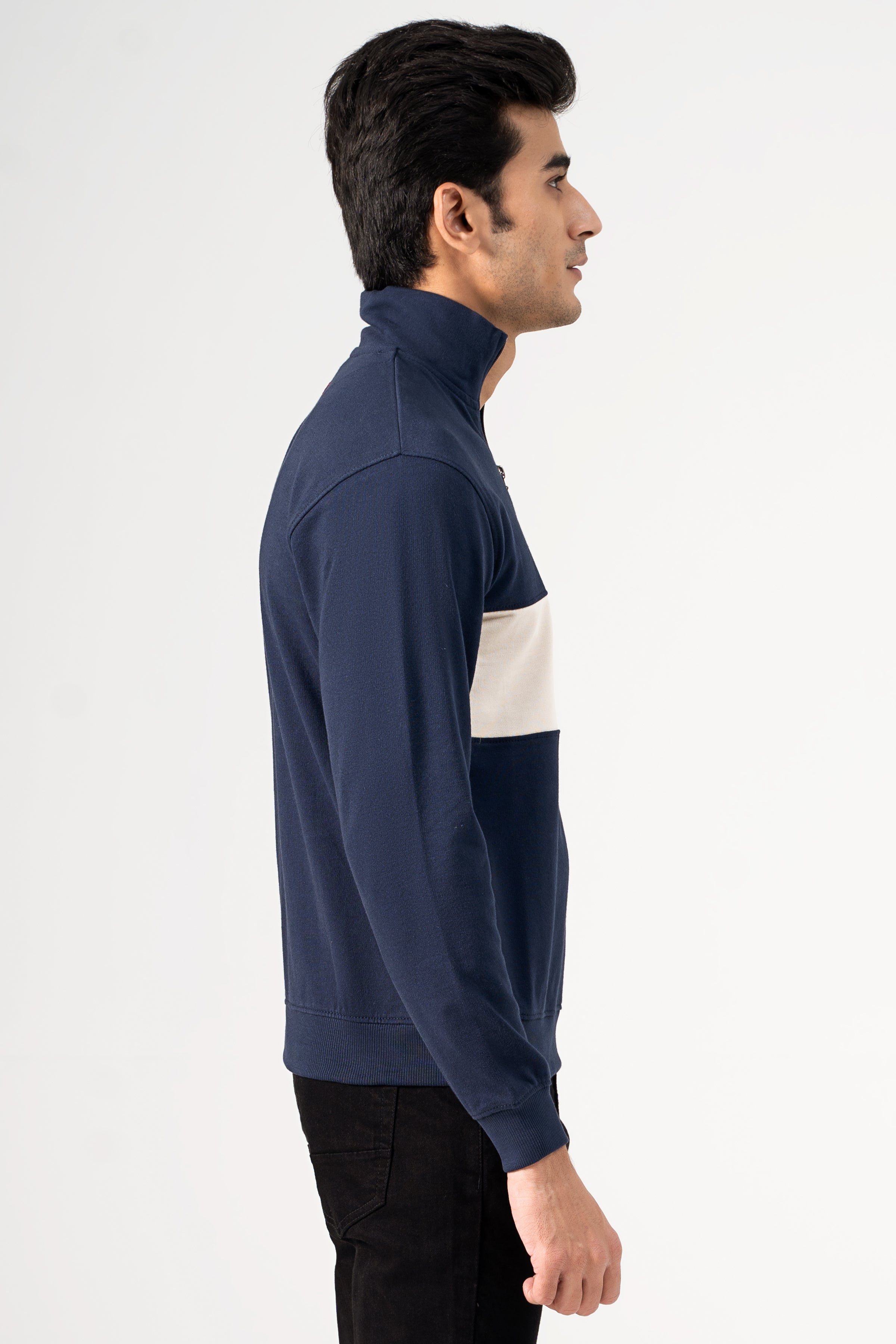 Navy mock neck sweatshirt side view with white chest panel and ribbed cuffs