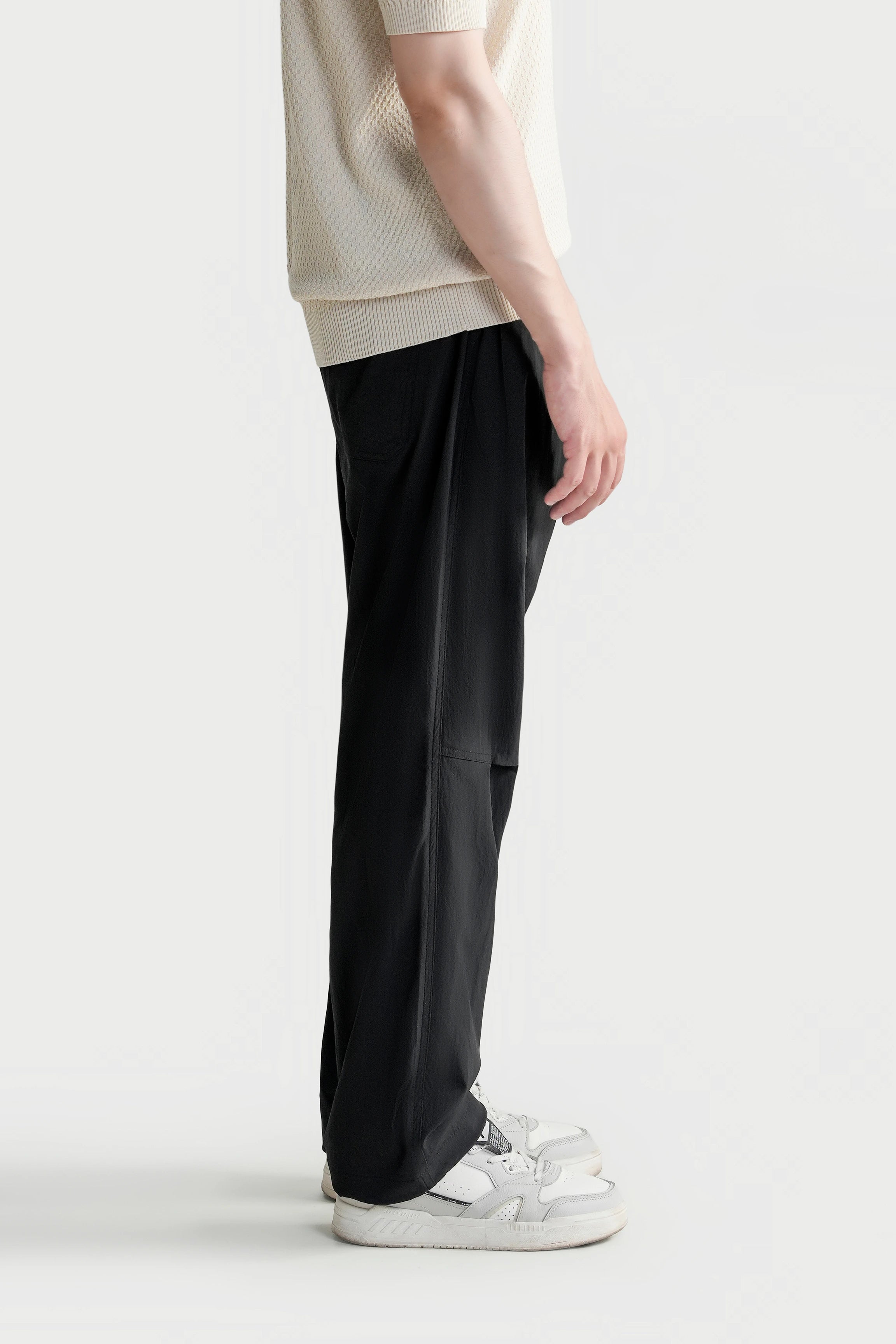 Black loose-fit trousers with straight wide leg and side pocket