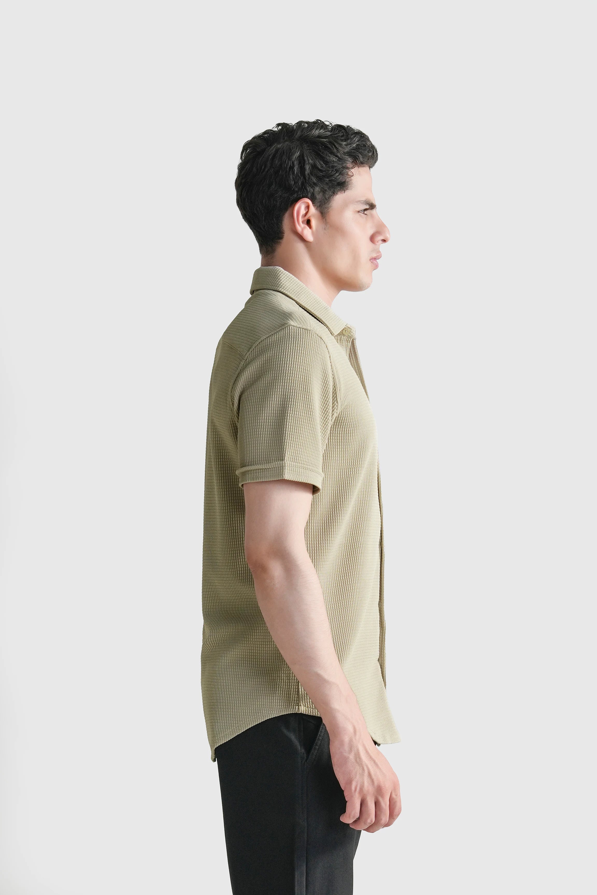 Khaki self-textured casual shirt, short sleeves, open collar, side profile