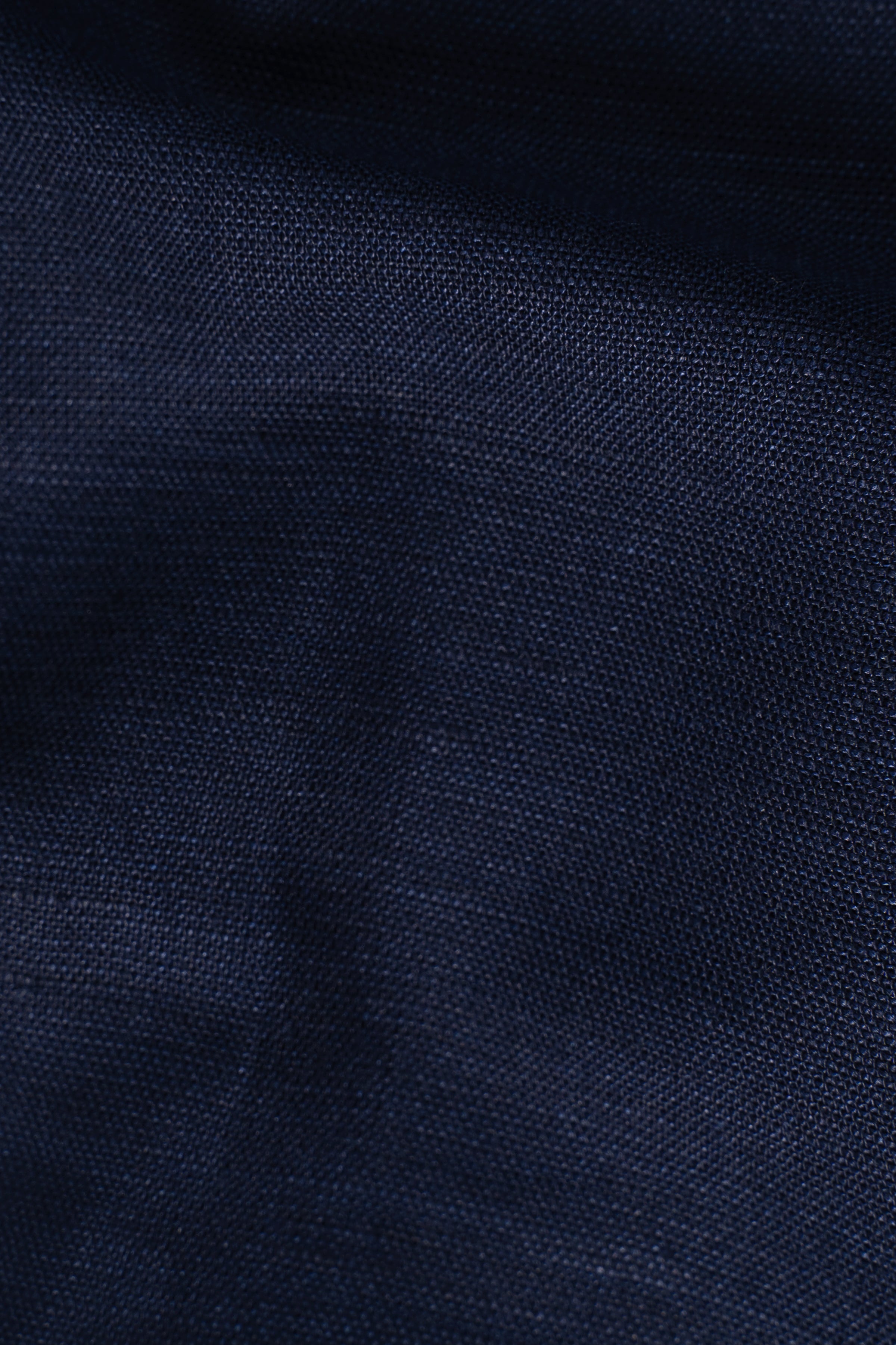 Navy linen shirt fabric close-up with fine woven texture