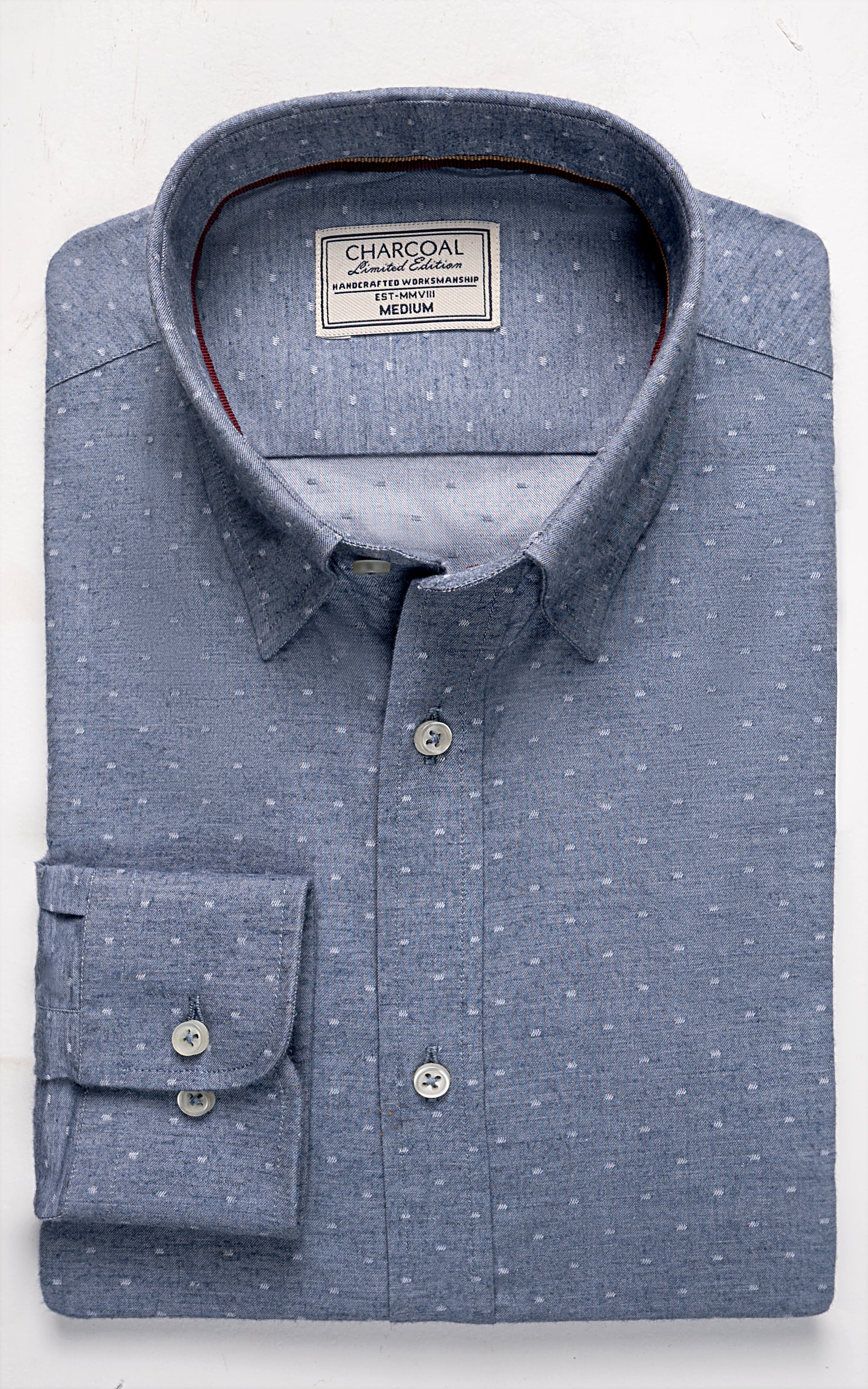 Chambray blue button-up shirt with speckled pattern, button cuffs, chest pocket