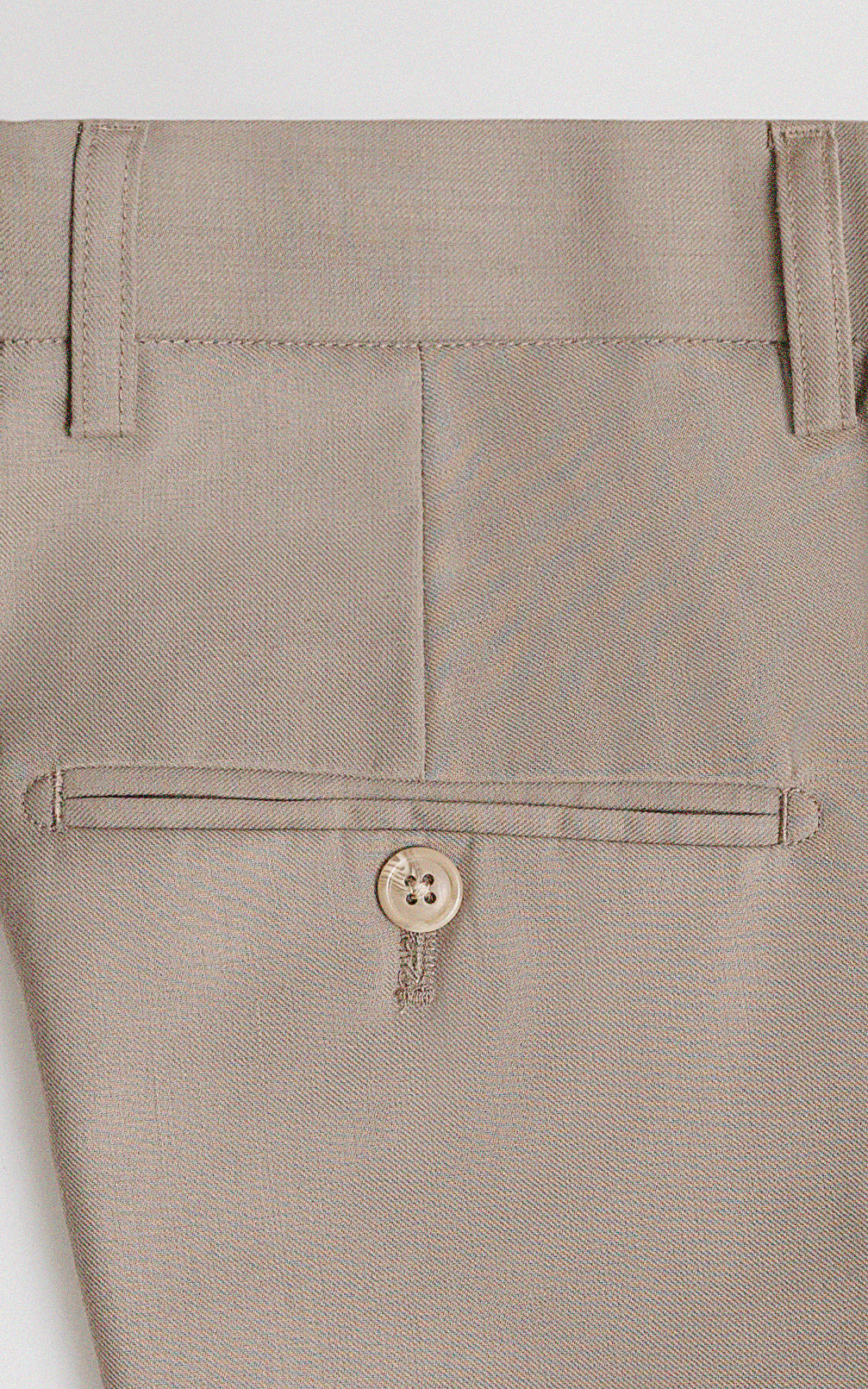 Light khaki dress pants buttoned pocket and belt loops detail