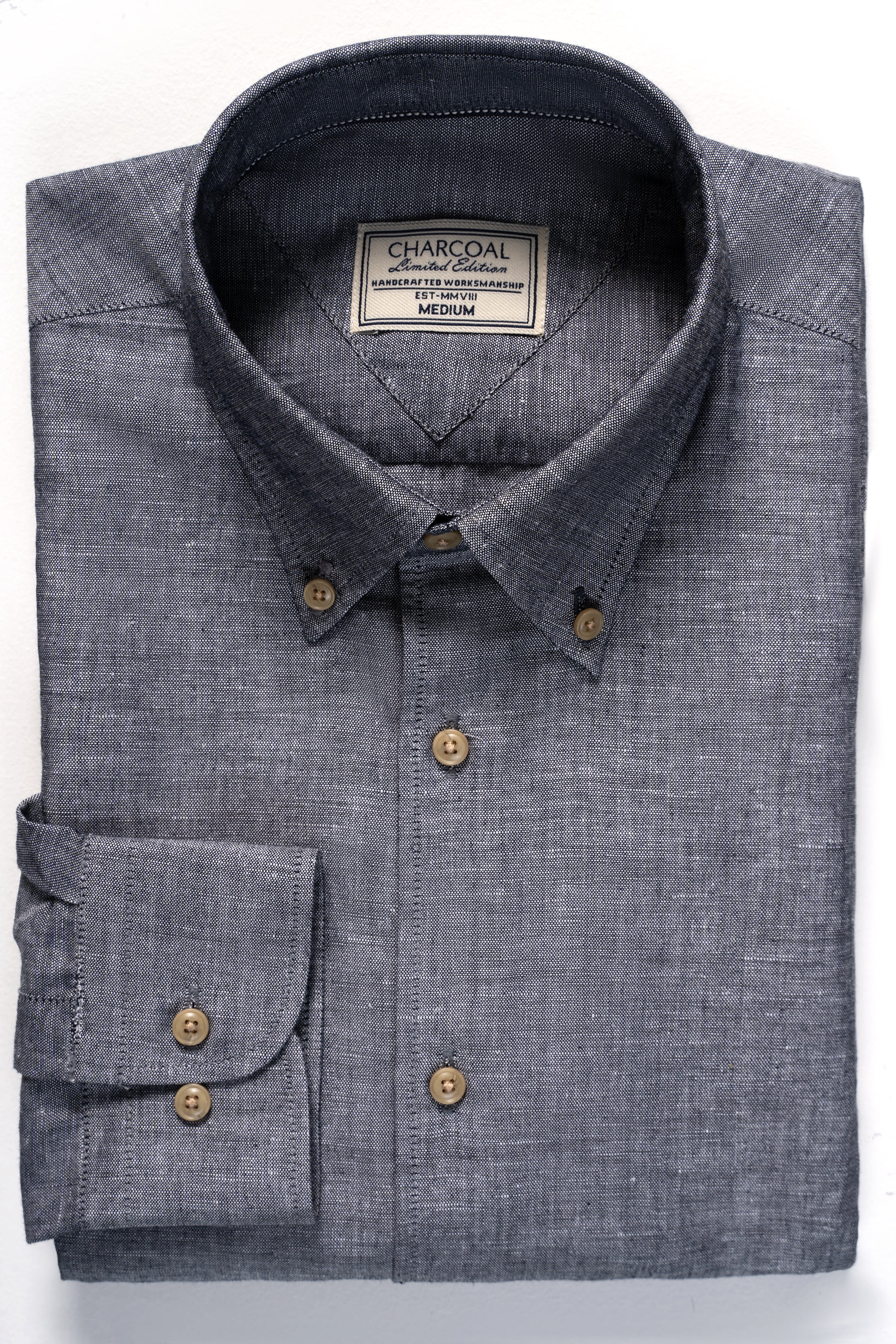 Chambray blue button-up shirt with chest pocket and dark buttons