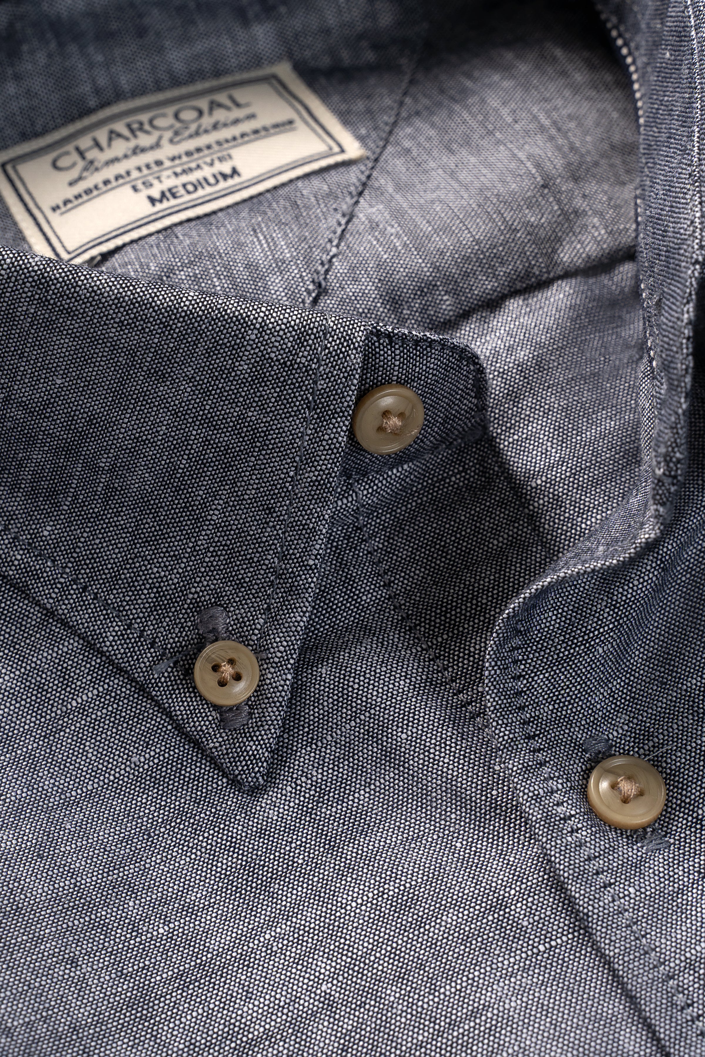 Chambray blue shirt collar close-up with two-button placket