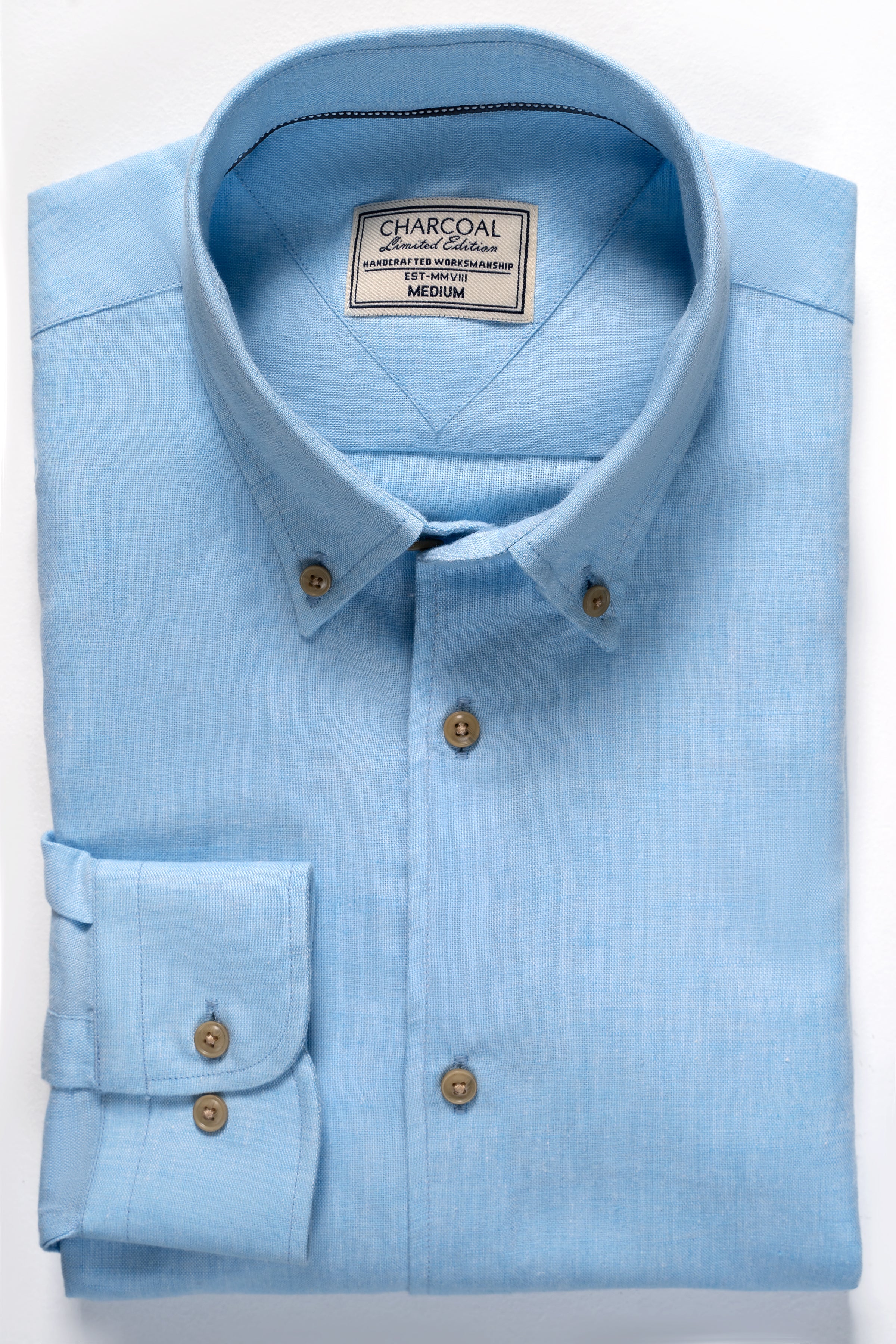 Sky blue linen fabric shirt with button-down collar and chest label