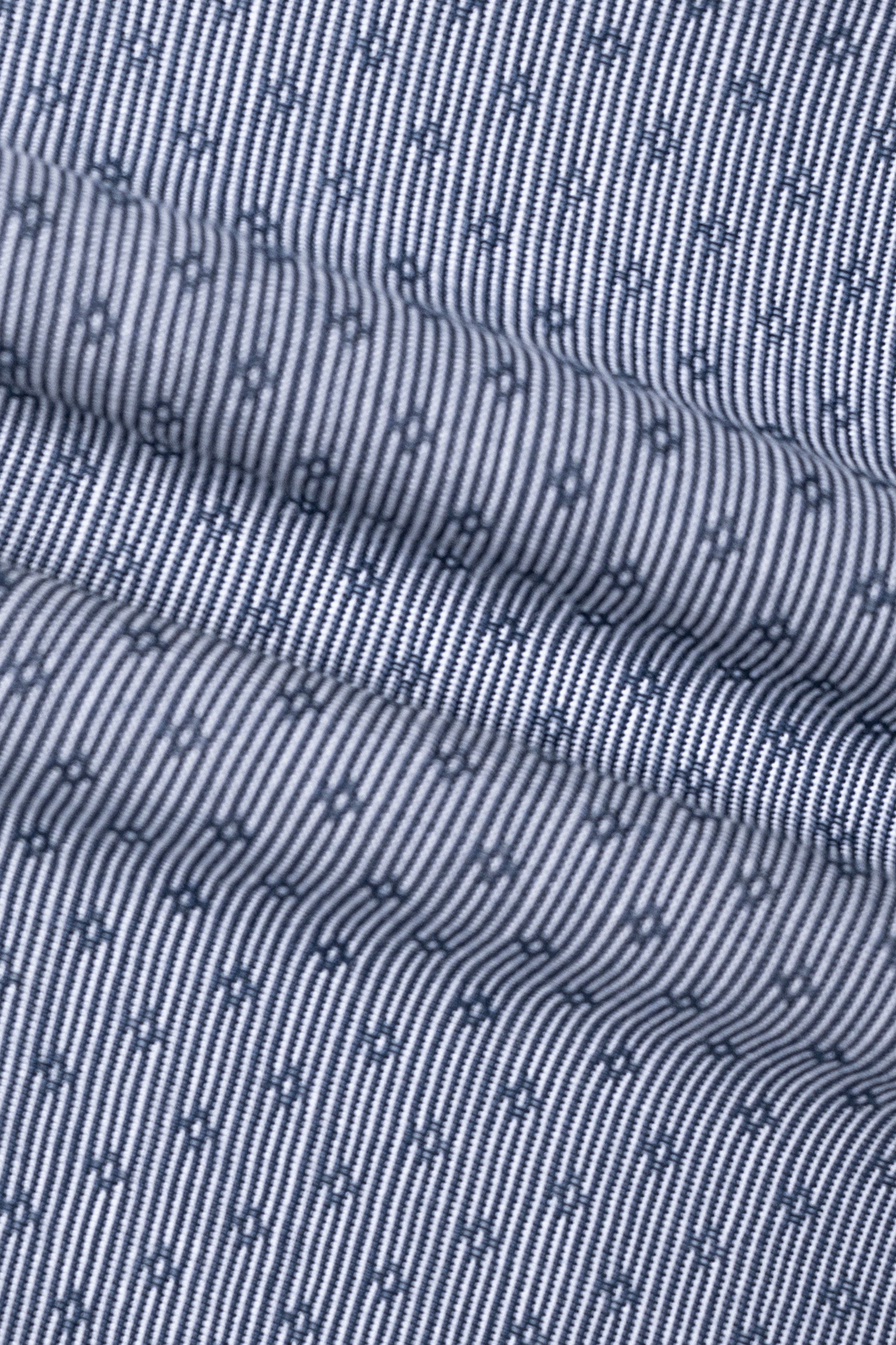 Greenish-blue patterned shirt fabric close-up