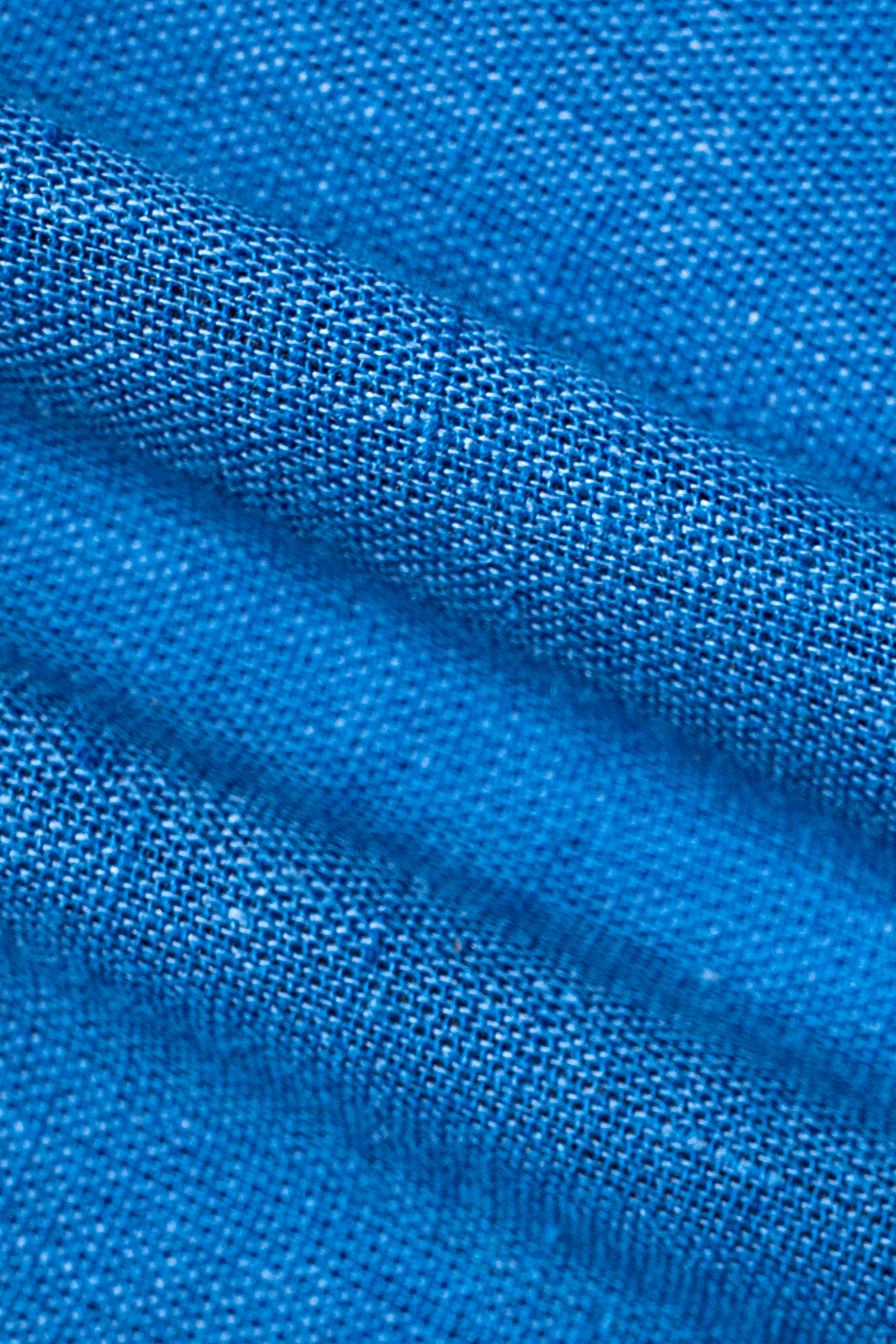Blue linen fabric texture close-up with fine weave
