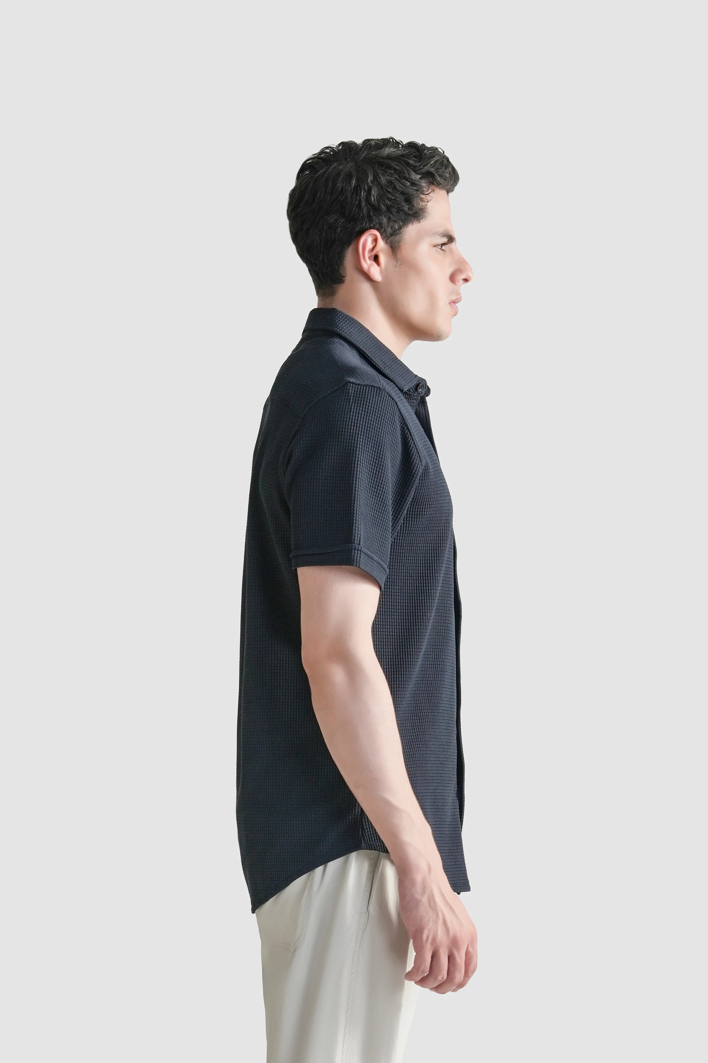 Navy self-textured casual shirt, side view with short sleeves and button placket