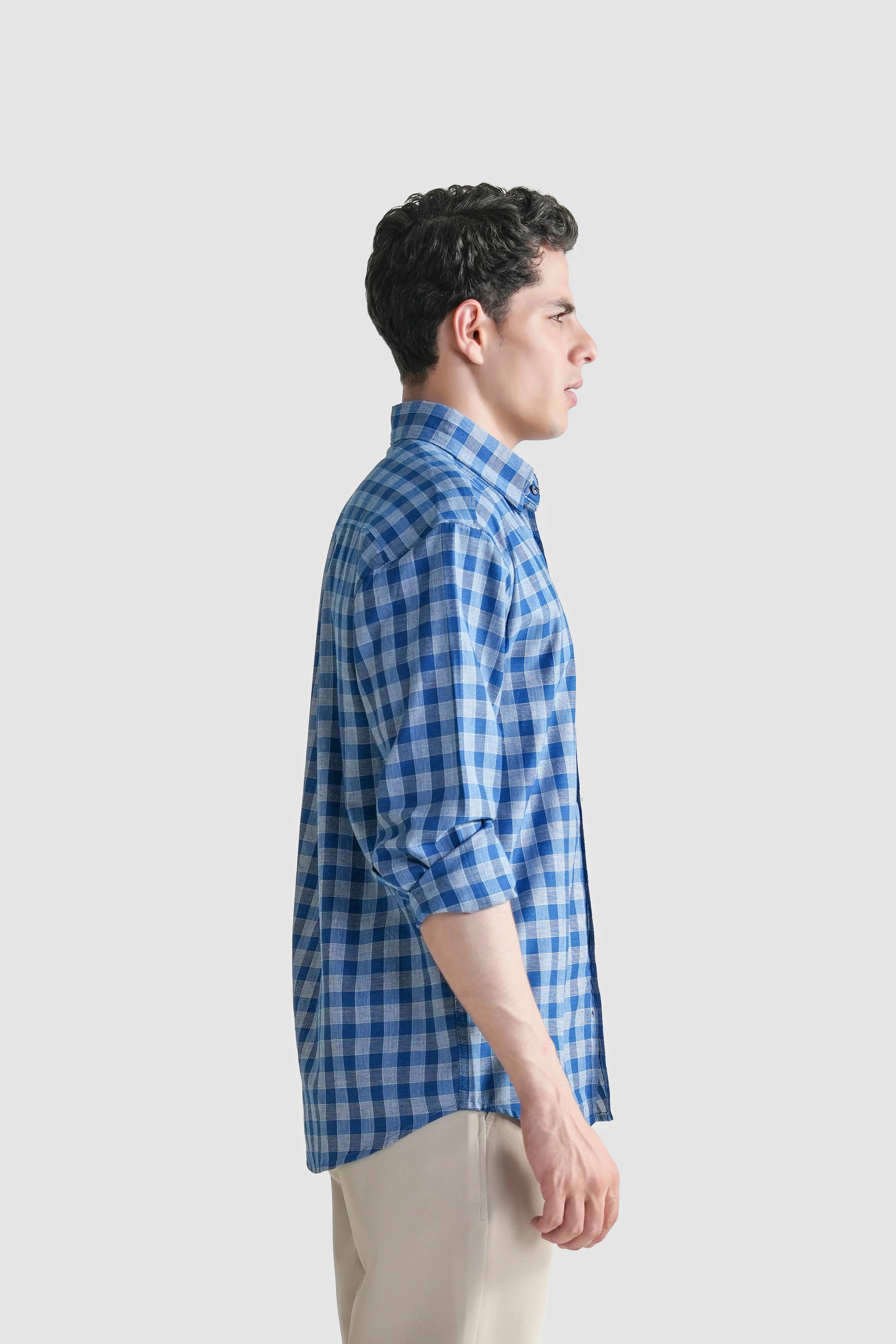 Blue and white checkered button-down shirt, side view, long sleeves