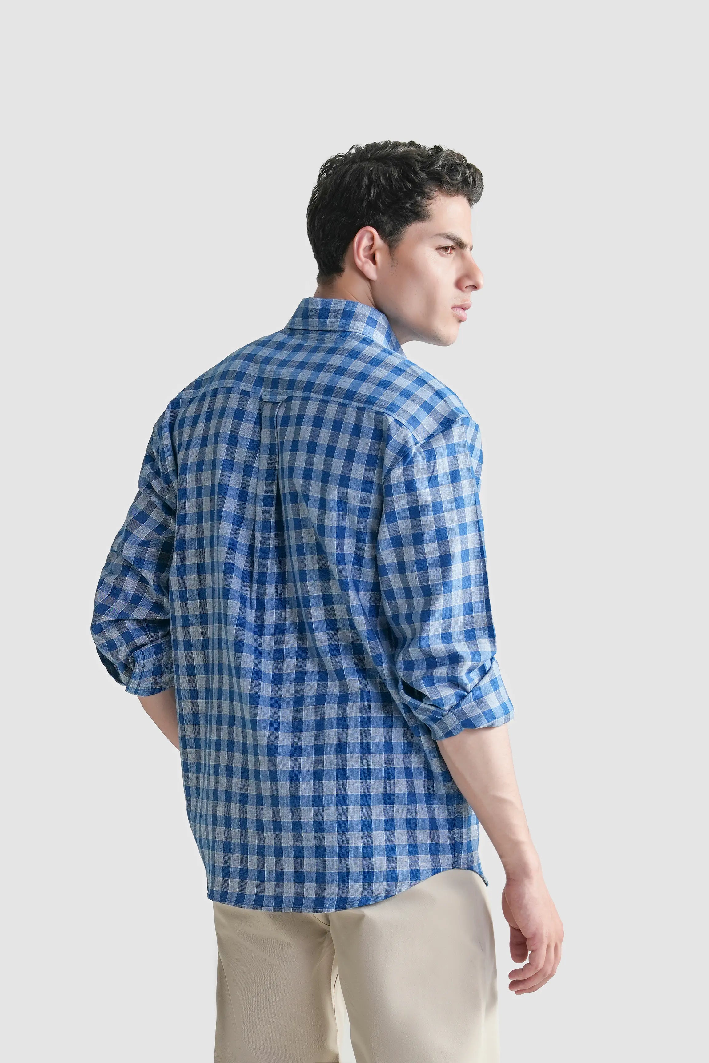 Blue and white checkered button-down shirt, back/side view, long sleeves