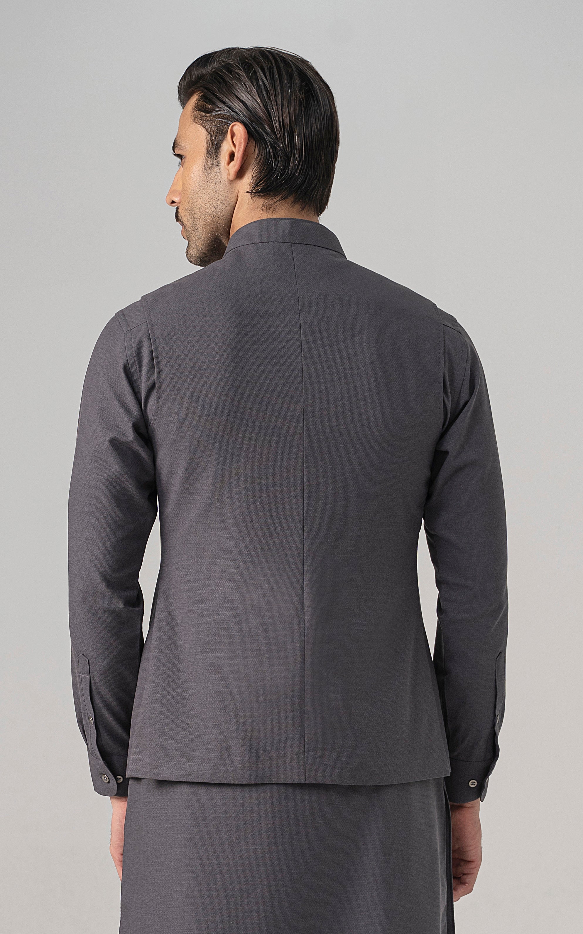 Mid-grey textured waistcoat on model, back view