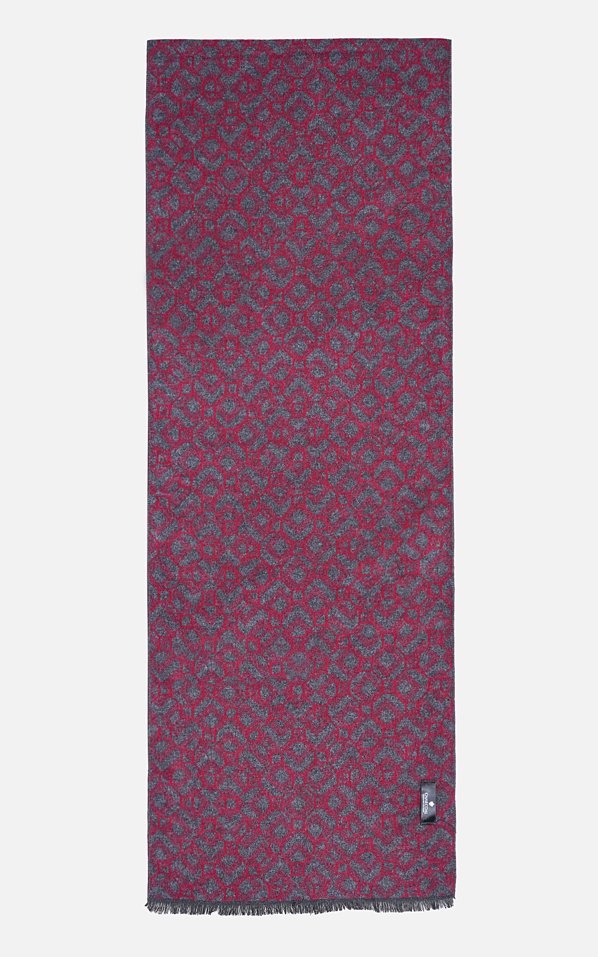 Scarf with maroon base and teal geometric pattern, fringed ends