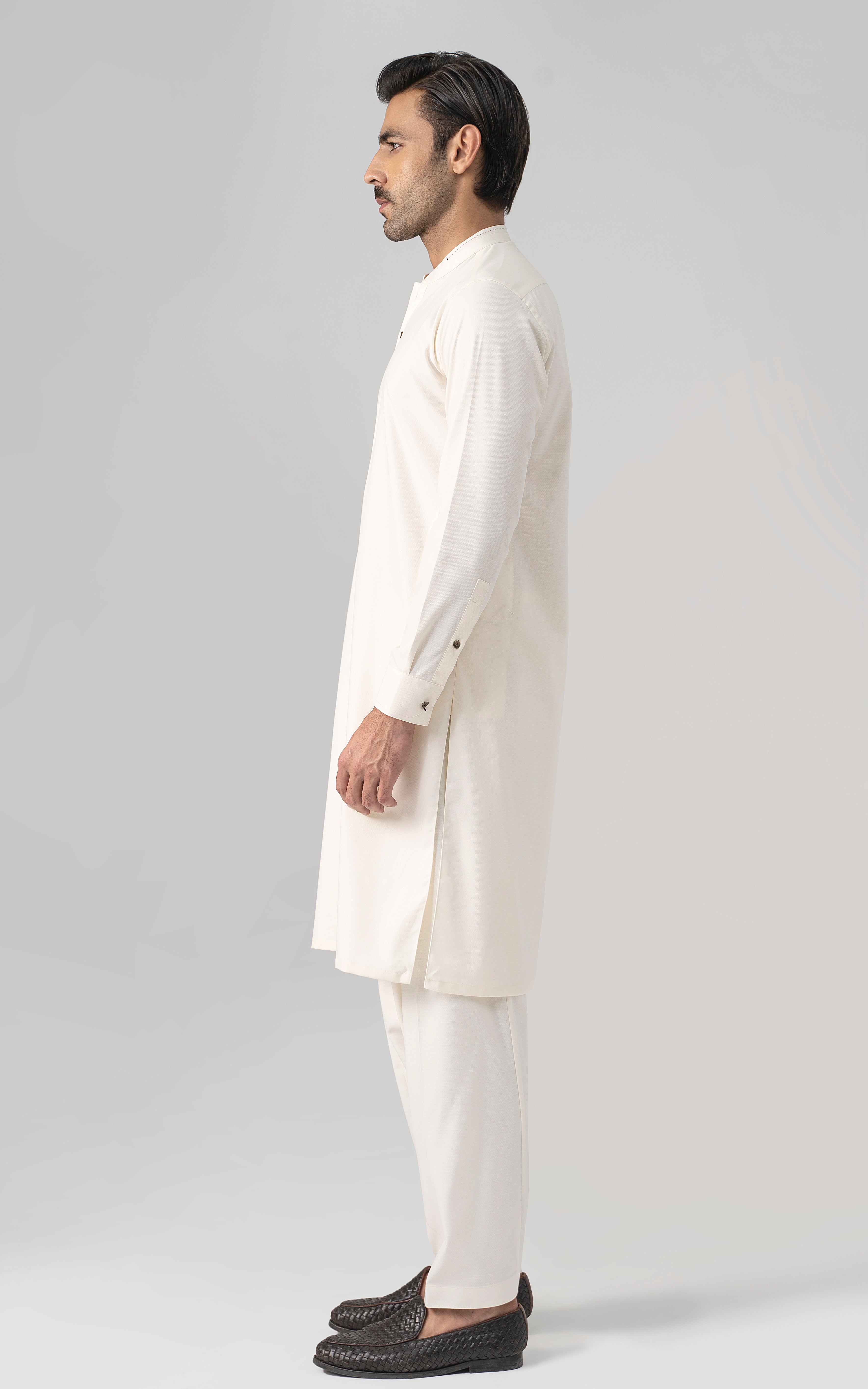 Off-white long kurta and matching pants, side view
