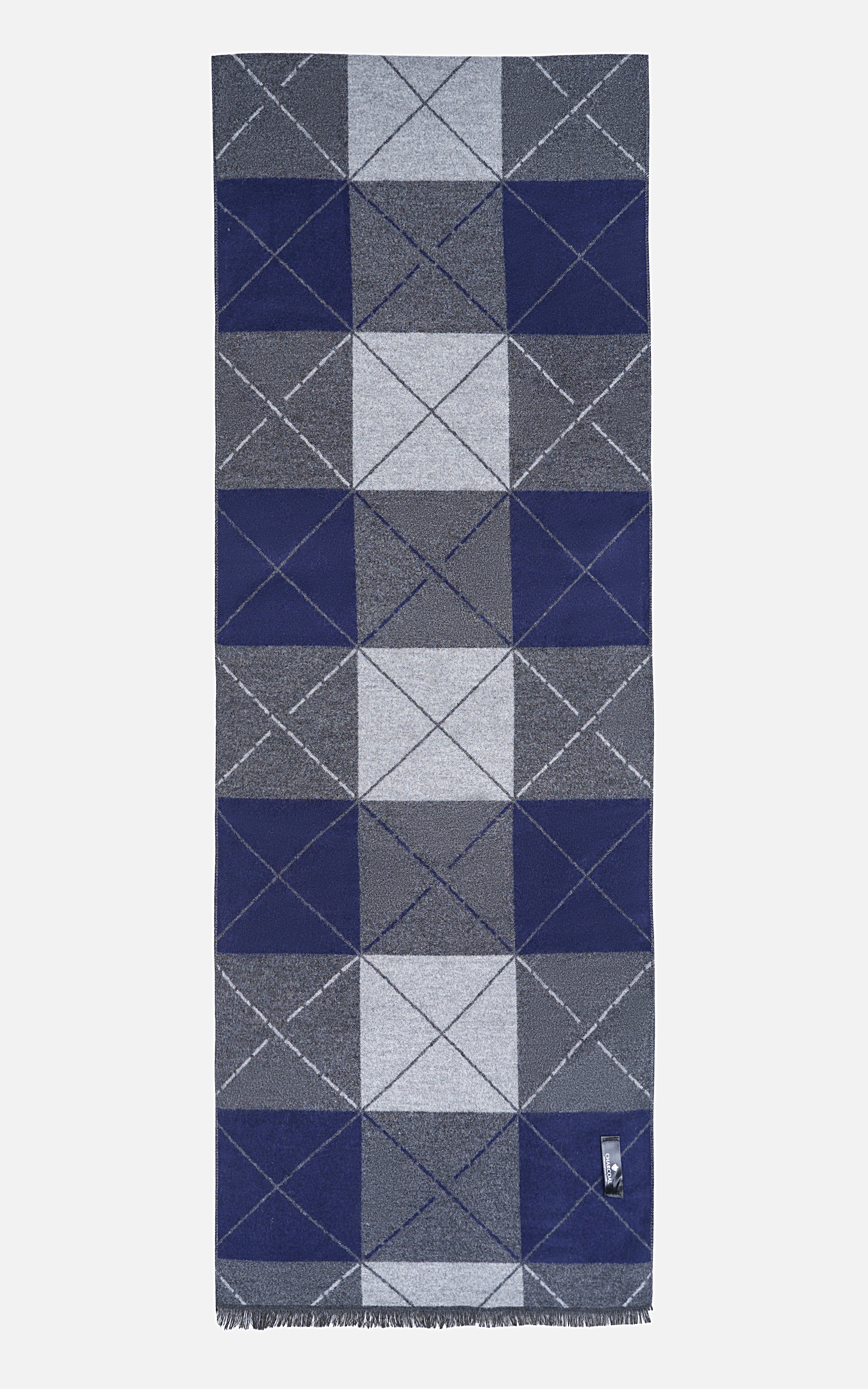 Scarf featuring repeating grid of navy, gray, and white squares, short fringes, tag at corner.