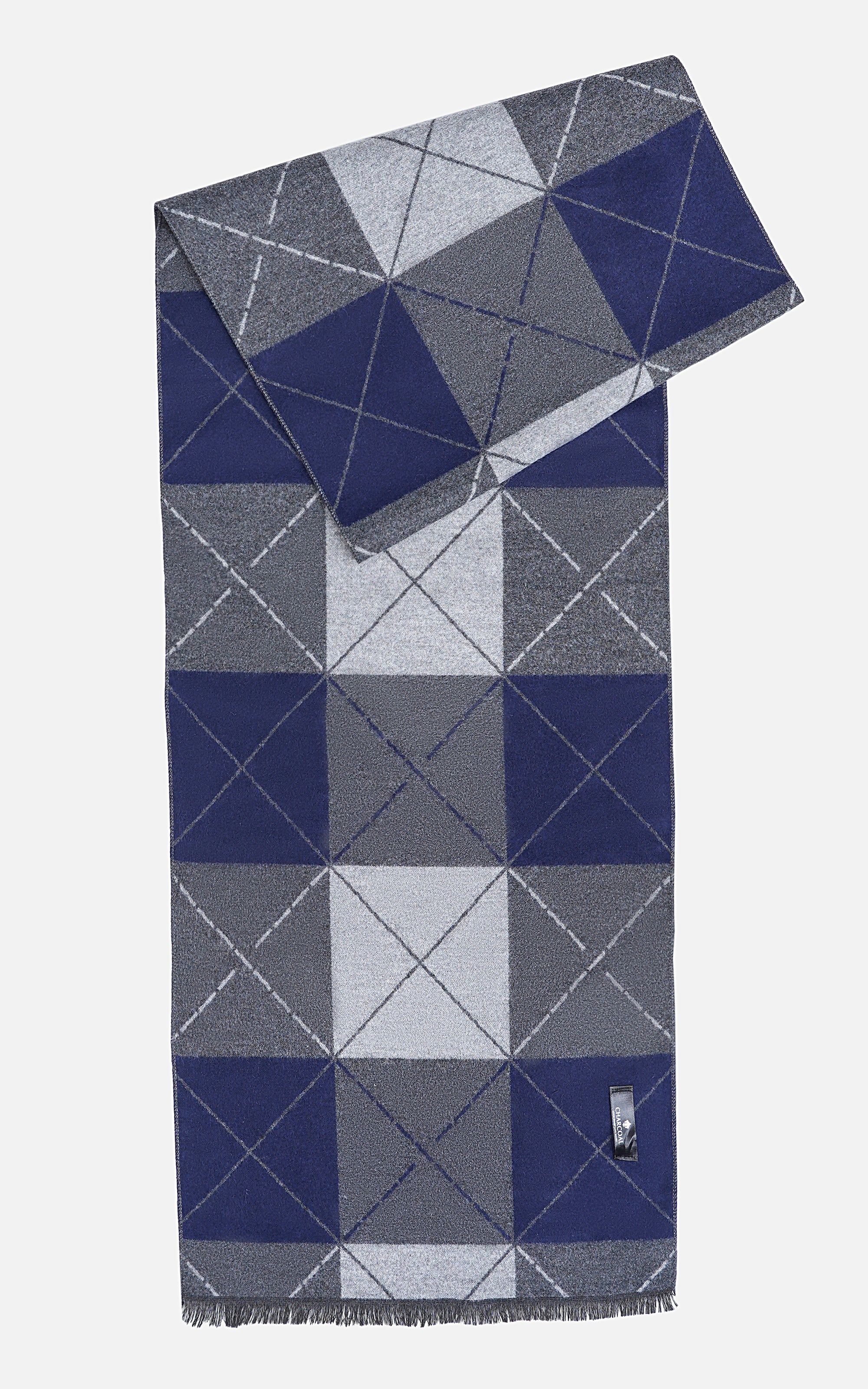 Geometric patchwork scarf in navy and gray with white blocks, fringed ends, corner logo tag.