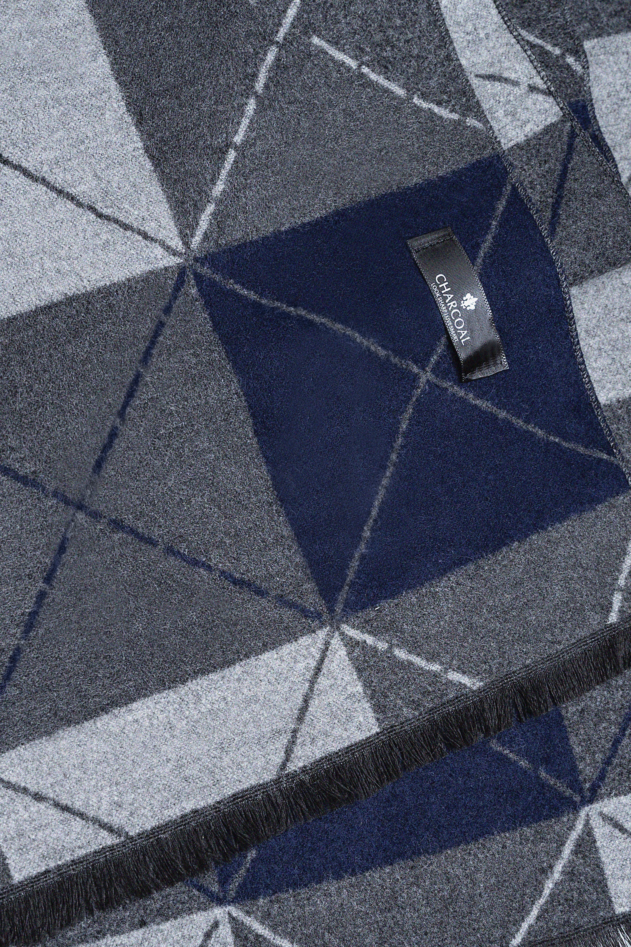 Scarf with geometric cube pattern in navy and gray, fringed hem, small brand label.