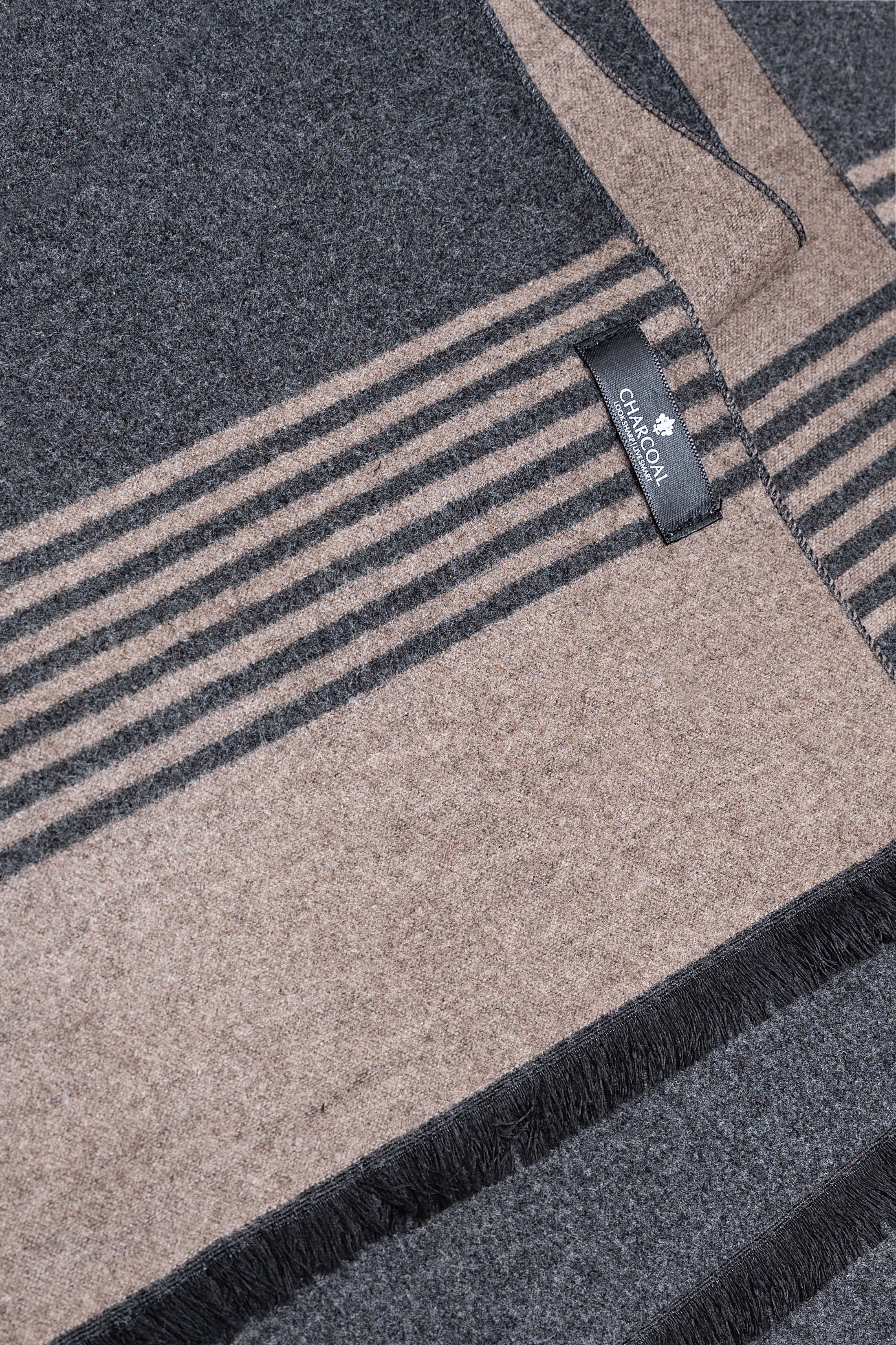 Navy and beige striped scarf with stitched label and fringe edge